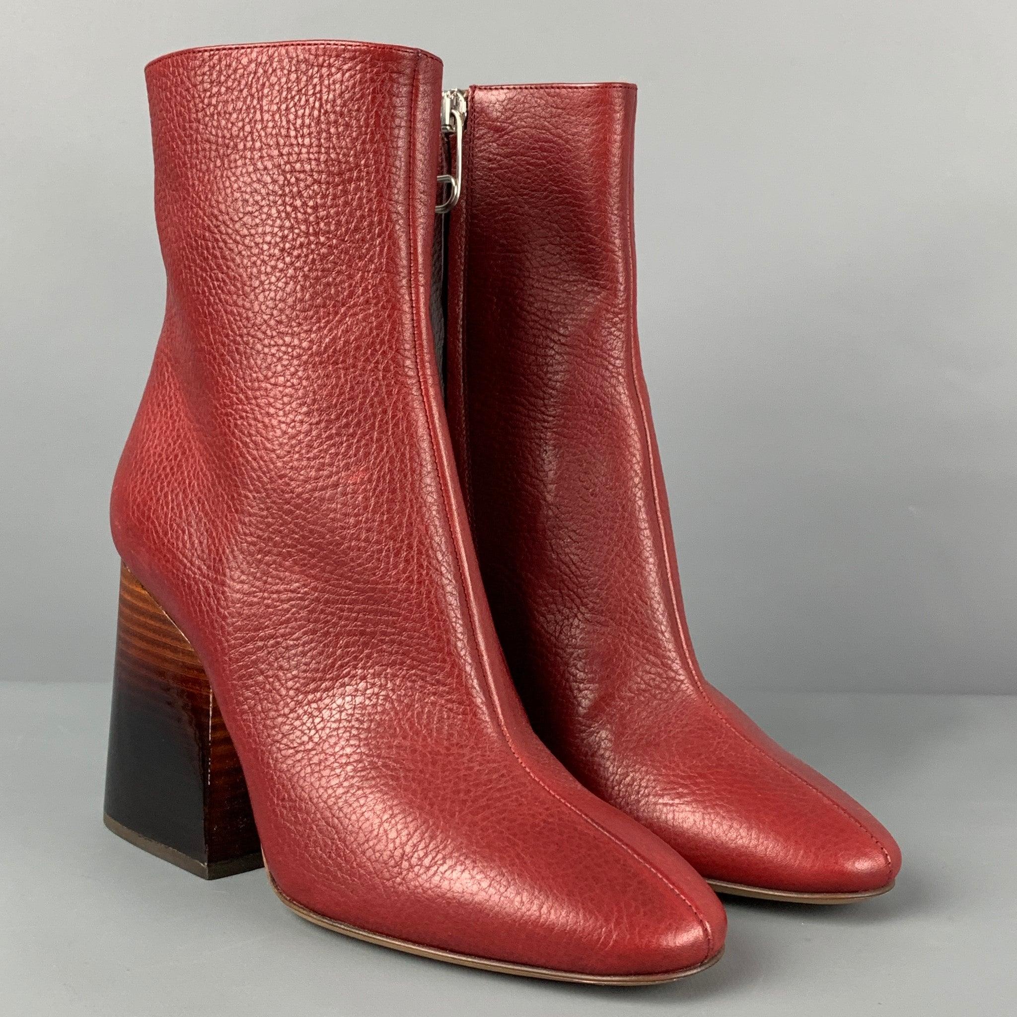 MAISON MARTIN MARGIELA boots comes in a red pebble grain leather featuring a side zipper closure and a ombre chunky heel. Made in Italy.
 New With Box.
  
 

 Marked:  36 
 

 Measurements: 
  Heel: 3.5 inches 
  
  
  
 Sui Generis Reference: