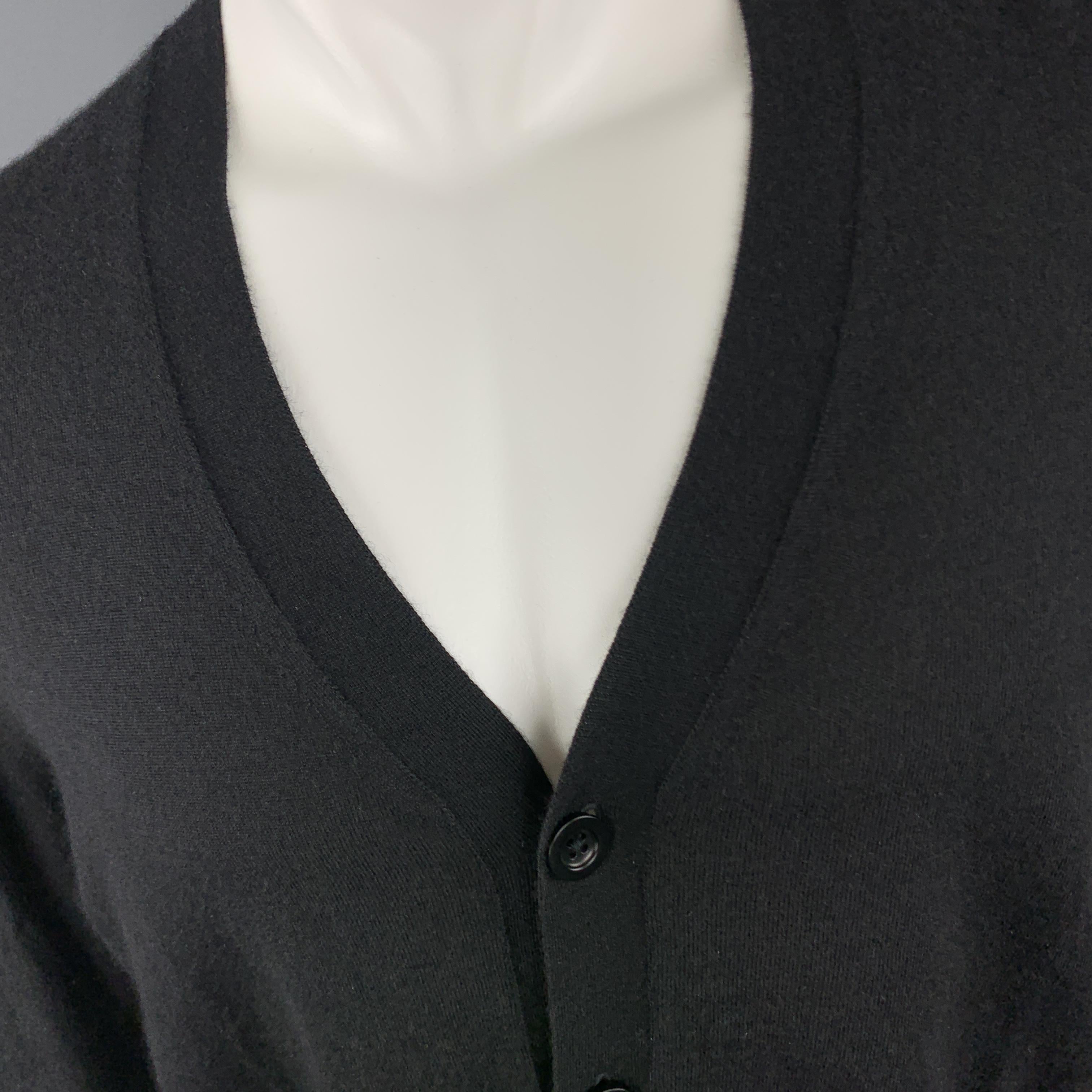 MAISON MARTIN MARGIELA cardigan comes in sheer cashmere knit with a v neck and white stitch back. Made in Italy.

Excellent Pre-Owned Condition.
Marked: 1

Measurements:

Shoulder: 18 in.
Chest: 41 in.
Sleeve: 27 in.
Length: 27 in.