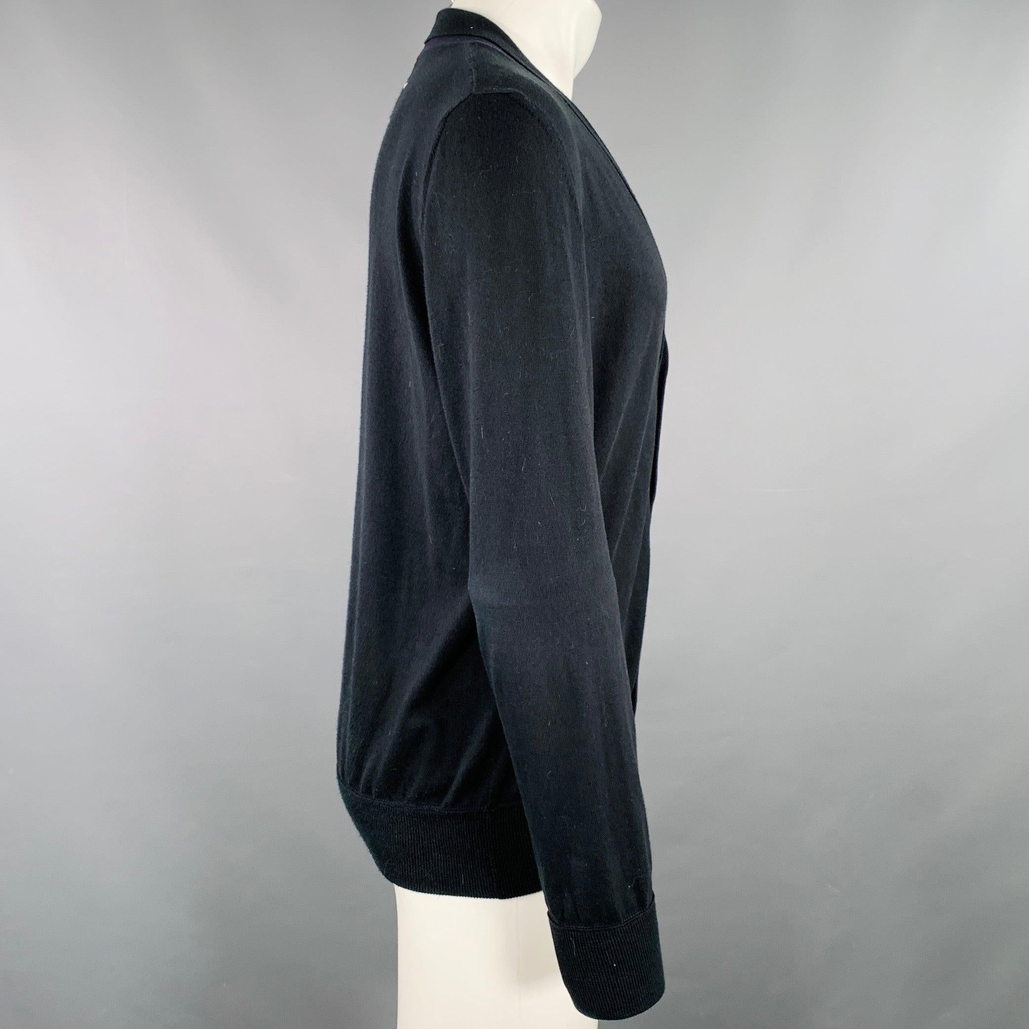 MAISON MARTIN MARGIELA cardigan
in a black cotton knit featuring a shawl collar, V-neck, and button closure. Made in Italy.Excellent Pre-Owned Condition. 

Marked:   M 

Measurements: 
 
Shoulder: 18 inches  Chest: 46 inches  Sleeve: 25.5 inches
