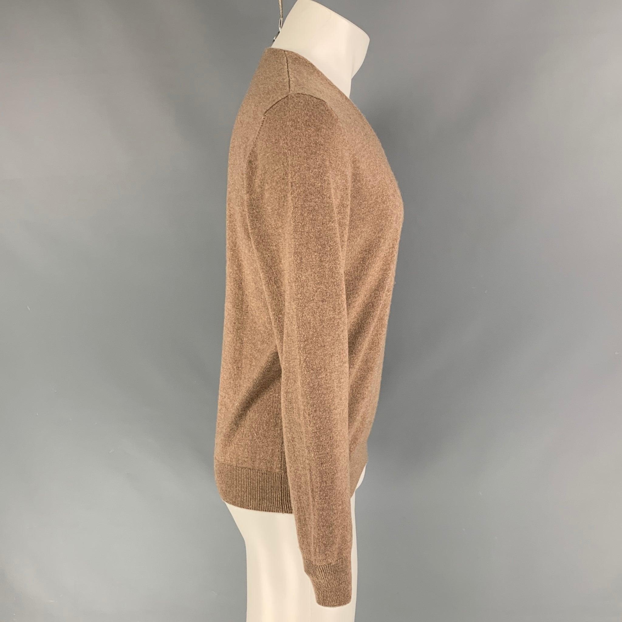 MARTIN MARGIELA pullover comes in a tan cashmere featuring long sleeves and a v-neck. Made in Italy.
Very Good
Pre-Owned Condition. Missing brand tag. 

Marked:   Size tag removed.  

Measurements: 
 
Shoulder: 16.5 inches  Chest: 40 inches  Sleeve: