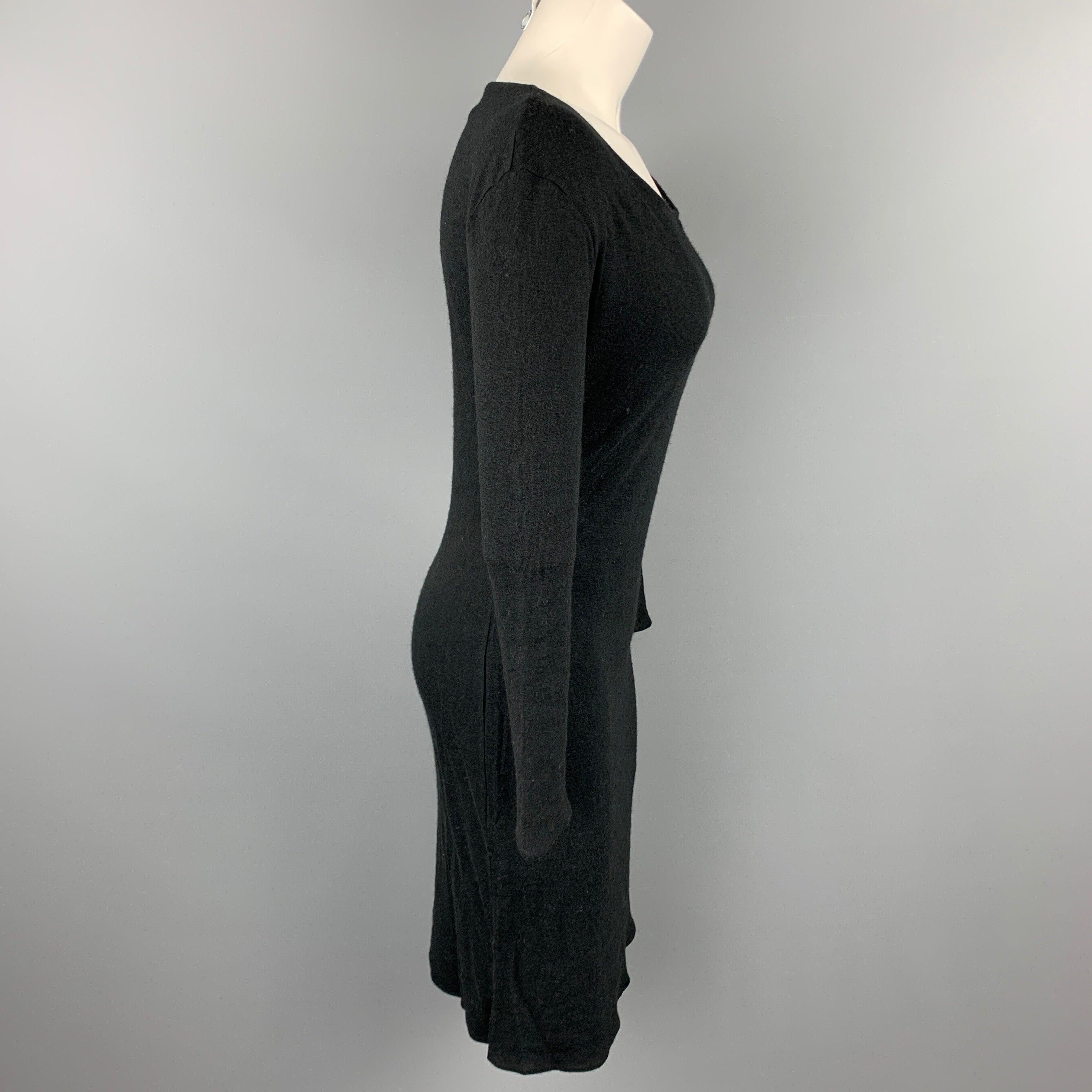 MAISON MARTIN MARGIELA sweater dress comes in a black viscose / wool featuring long sleeves and a front button closure detail. Made in Italy.Very Good
Pre-Owned Condition. 

Marked:   S 

Measurements: 
 
Shoulder: 18 inches Bust: 34 inches Waist: