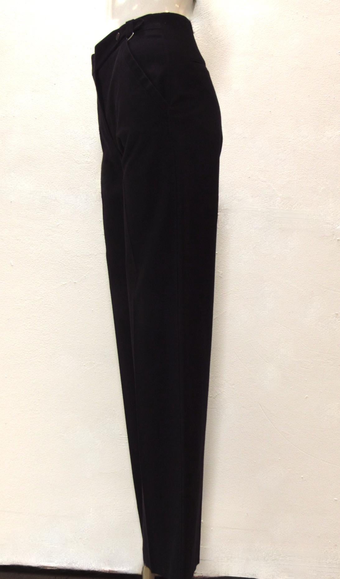 These beautifully textured black straight pants from Maison Martin Margiela are a blend of cotton and rayon. They feature a zip fly, slanted front pockets, and two back pockets. 