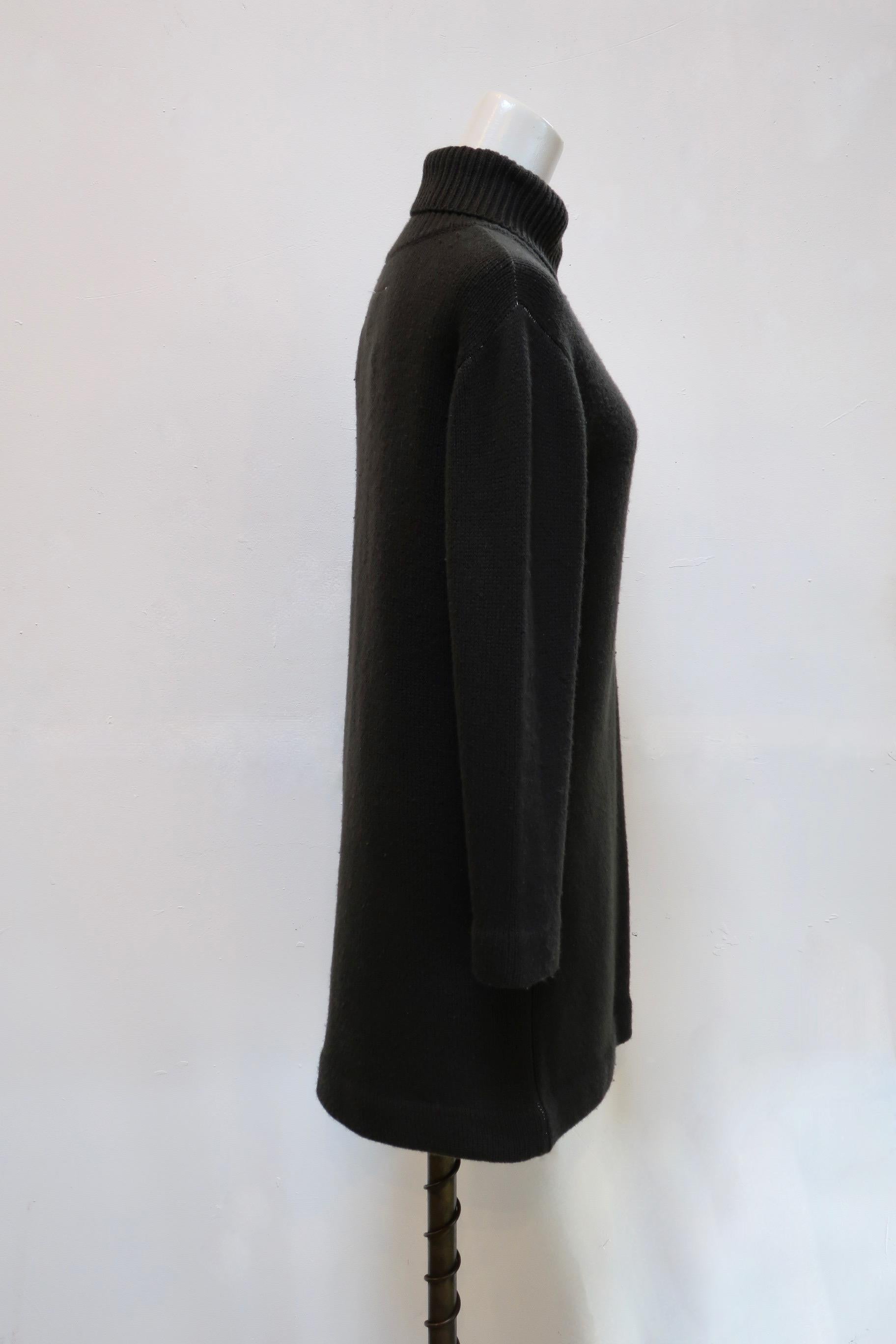 This thick olive turtleneck sweater dress is from Maison Martin Margiela. 