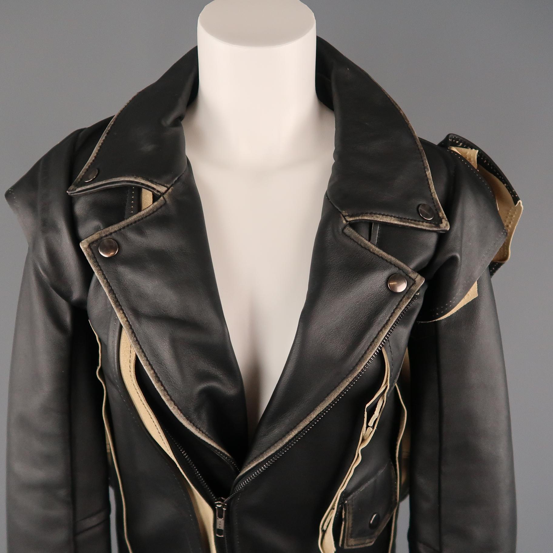 Coveted MAISON MARTIN MARGIELA X H&M Spring 2012 Re-Edition biker jacket comes in black leather with a pointed distressed lapel, asymmetrical zip, and patchwork cutouts throughout.
 
Excellent Pre-Owned Condition.
Marked: 2
 
Measurements:
