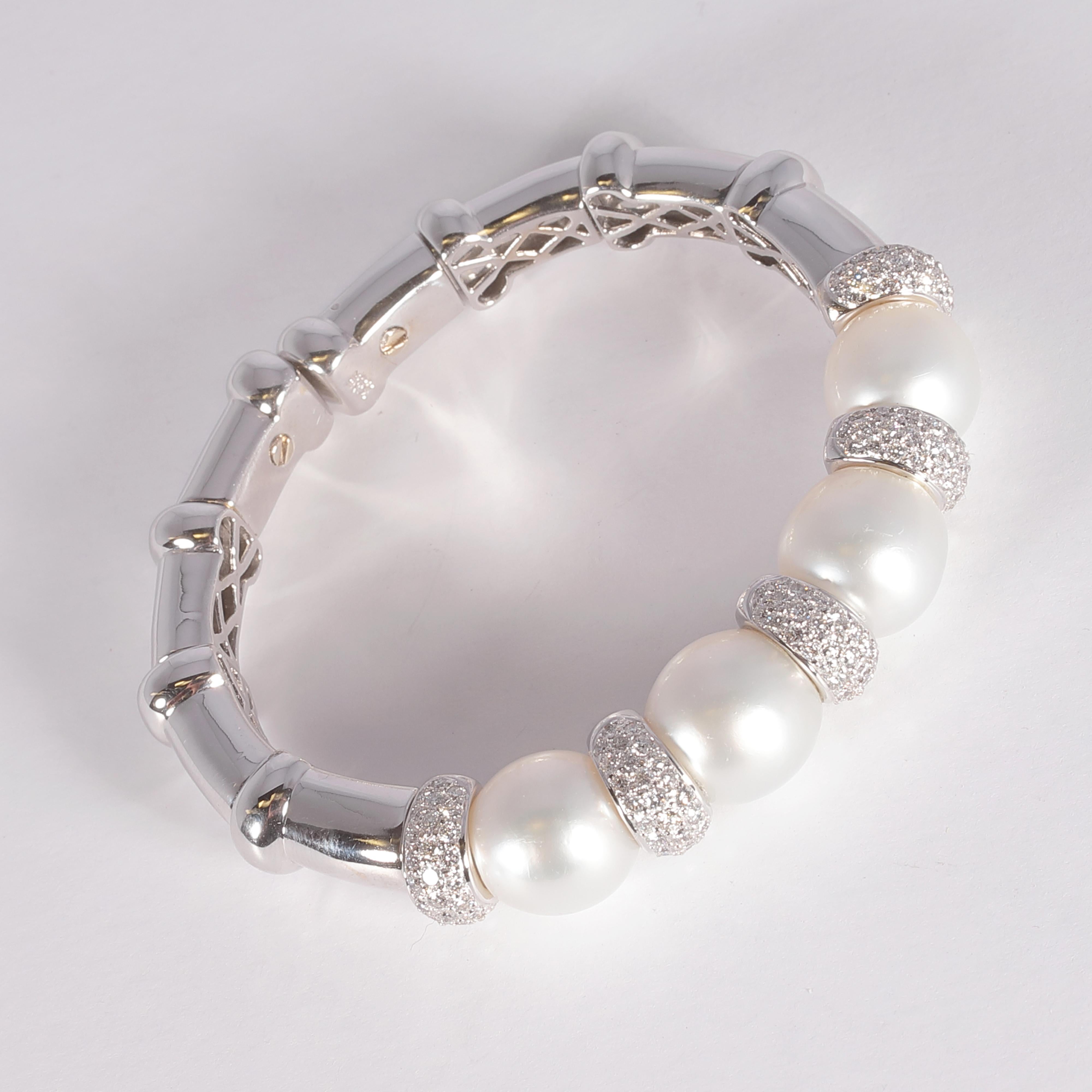 A timeless classic, this cuff is in 18 karat white gold and supports four South Sea pearls, measuring approximately 12.10 mm to 12.30 mm and features diamond rondells with a stated total weight of 3.21 carats.  It is so comfortable and easy to wear!