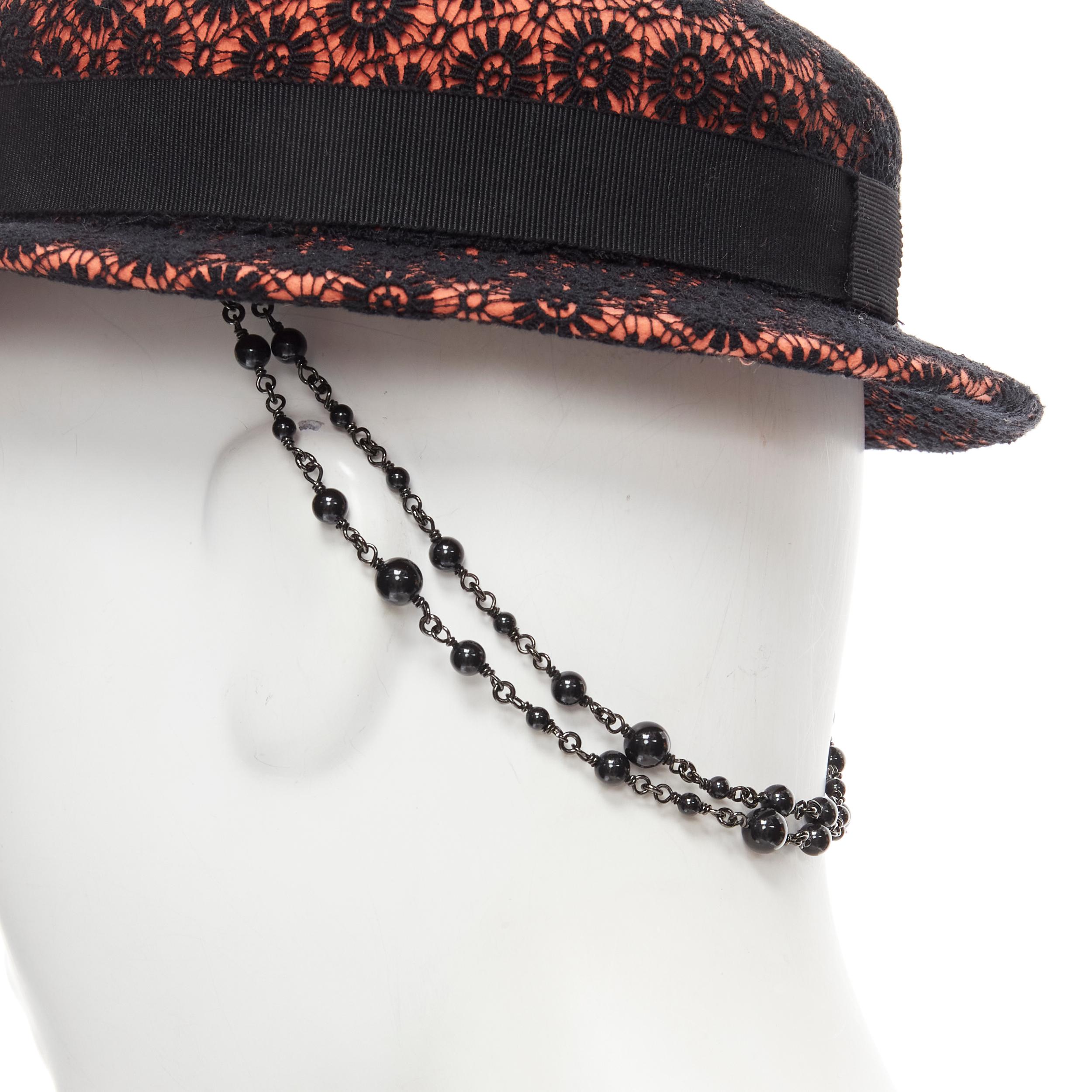 MAISON MICHEL black floral lace orange felt black pearl chain topper fedora hat 52cm 
Reference: MELK/A00156 
Brand: Maison Michel 
Material: Wool 
Color: Orange 
Pattern: Floral 
Extra Detail: Black floral lace embroidery covered wool felt.