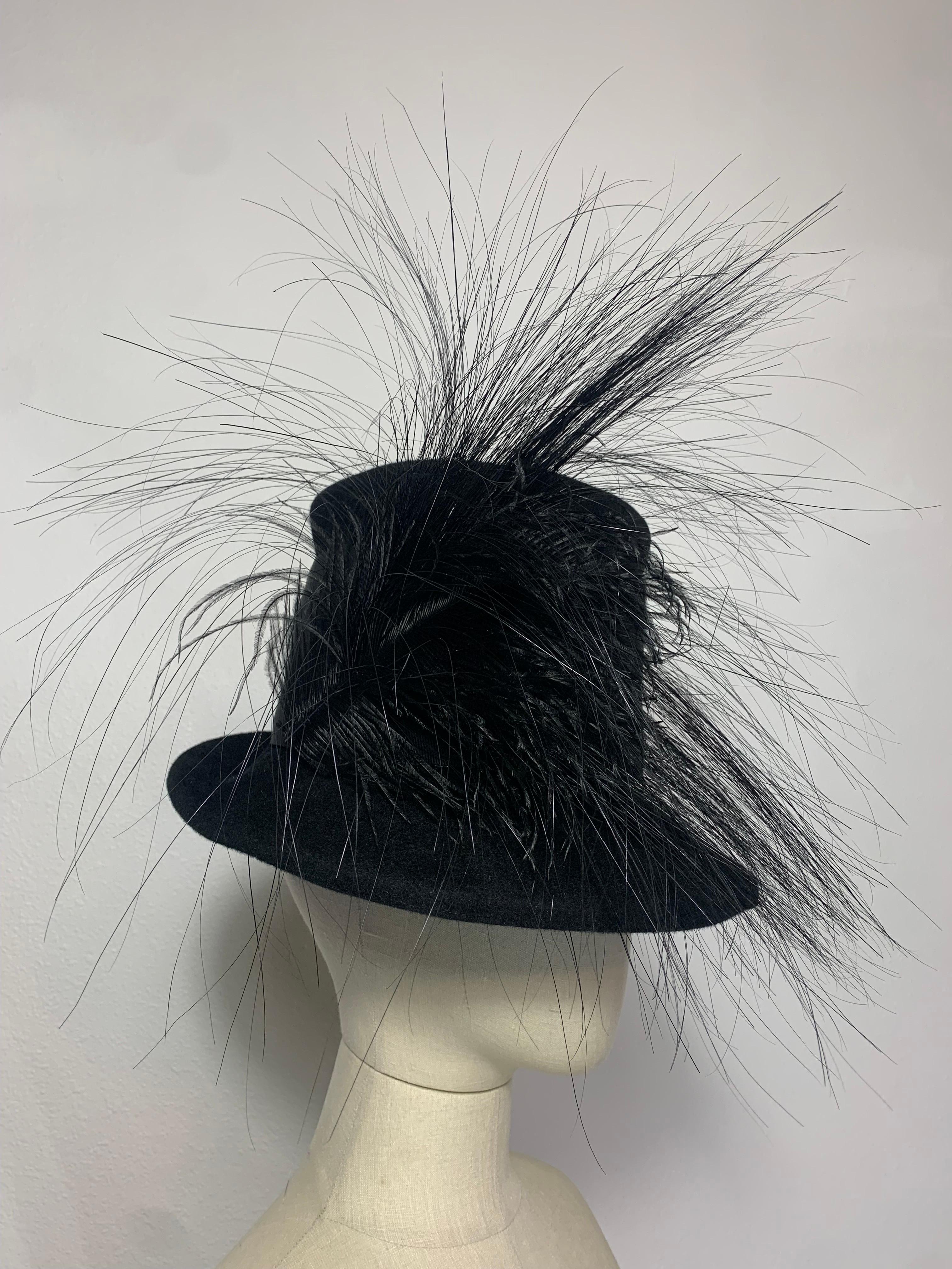 Maison Michel Autumn/Winter Black Fur Felt Short-Brim Tall Crown Hat w Extravagant Feathers:  Extra-wide grosgrain ribbon band and a mixture of black ostrich and egret feathers at side. Attached combs for securing. Size US 7. Made in France. 