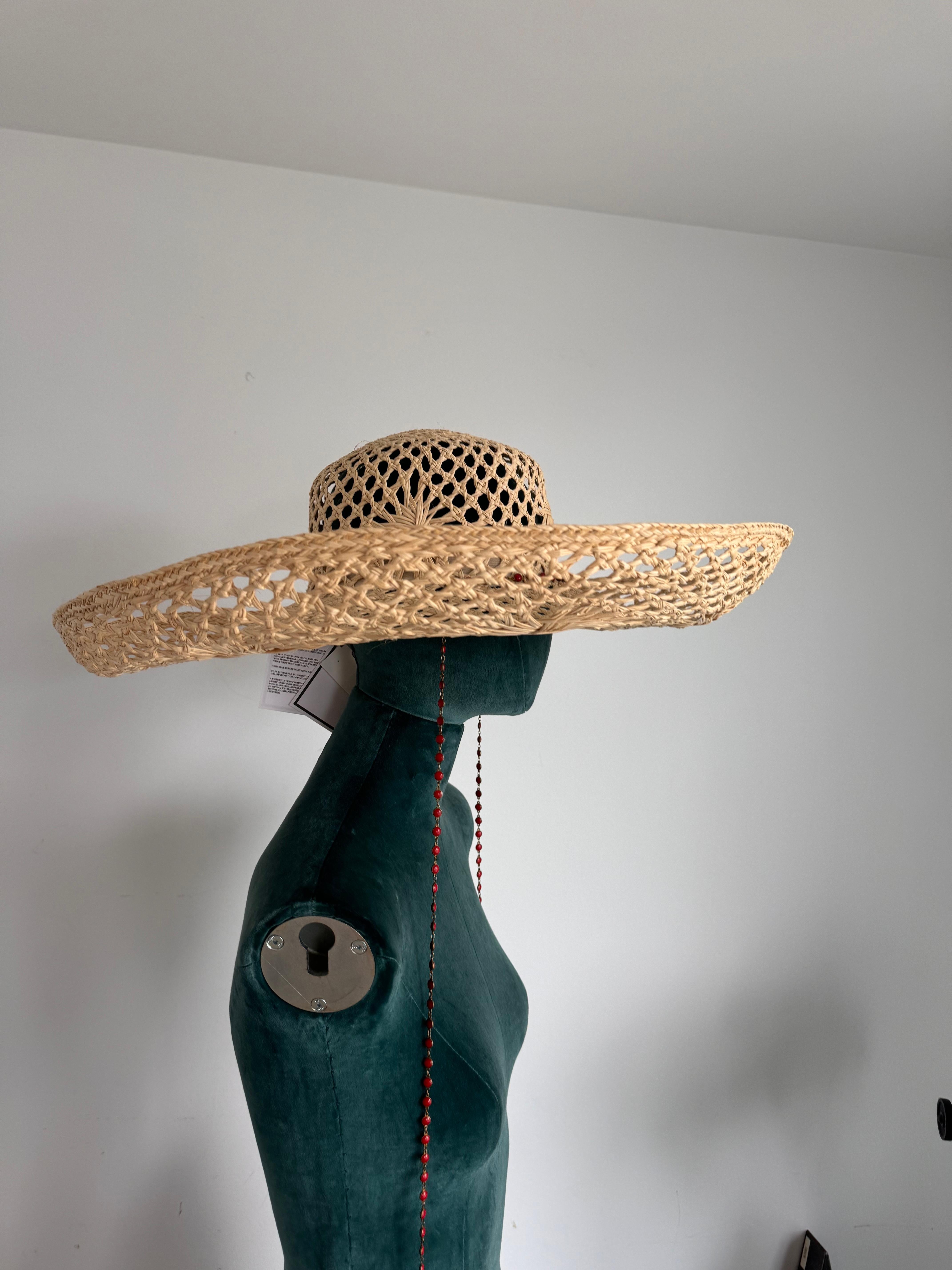 Discover the captivating allure of the Maison Michel Oversized Mexican-Inspired Straw Hat, a sartorial masterpiece that blends traditional craftsmanship with contemporary flair. Perfect for sunny days and chic getaways, this hat is a stunning