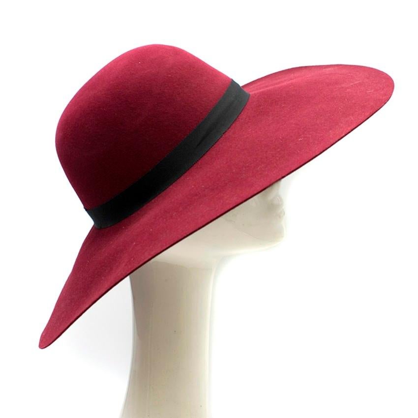 Maison Michel Burgandy Felt Wide Brimmed Hat

- Burgandy felt
- Wide brimmed hat
- Black ribbon wrapped around the circumference of the hat embellished with a black metal 'M'

Please note, these items are pre-owned and may show some signs of