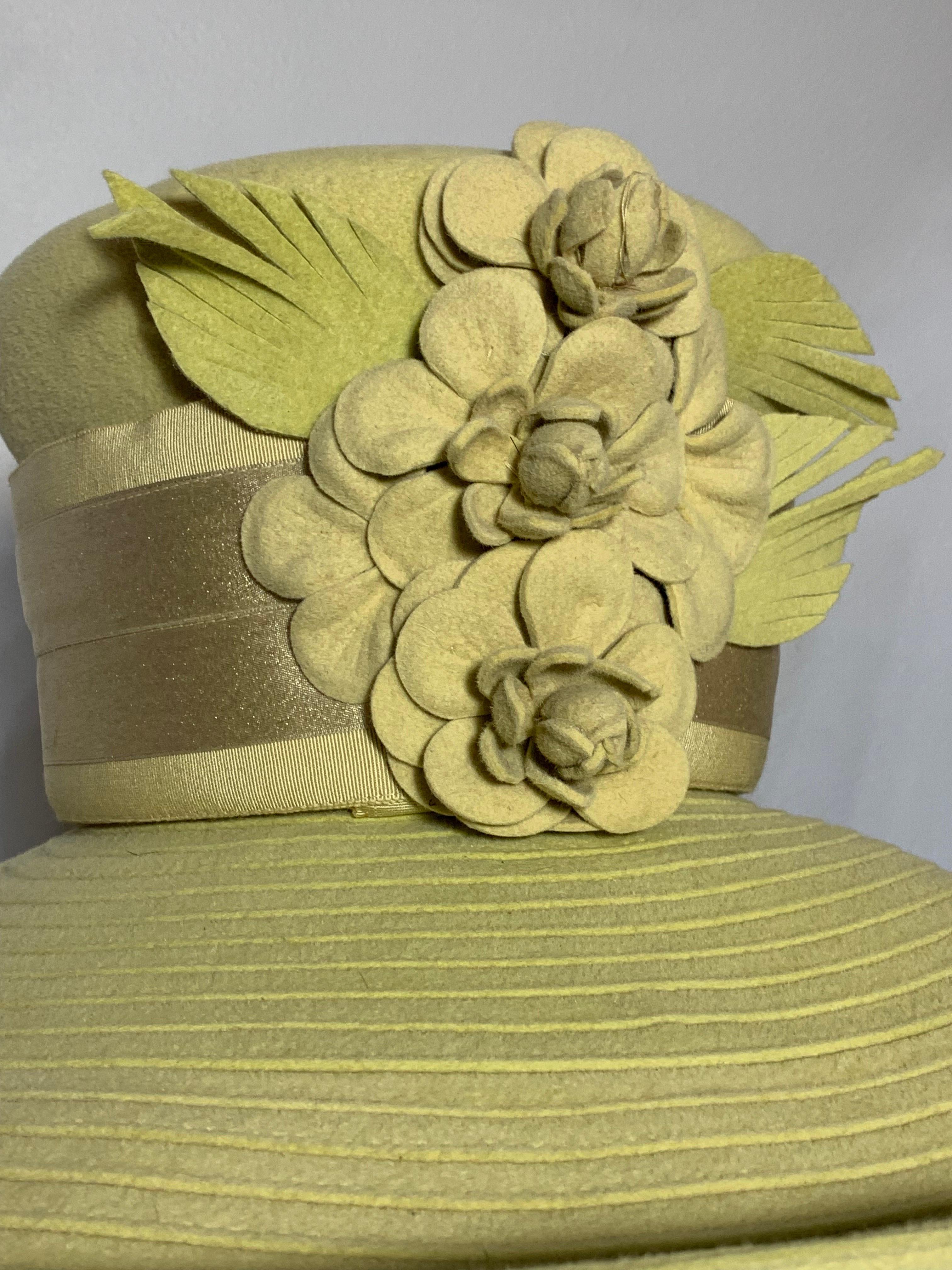 Maison Michel Autumn/Winter Citrine Wool Felt Large-Brim Hat w Camellias & Ribbon Band:  Large brim is worked in concentric stitched circles as a straw would be made. Tall wide crowned hat has wired brim, and contrasting wide ribbon hat band and