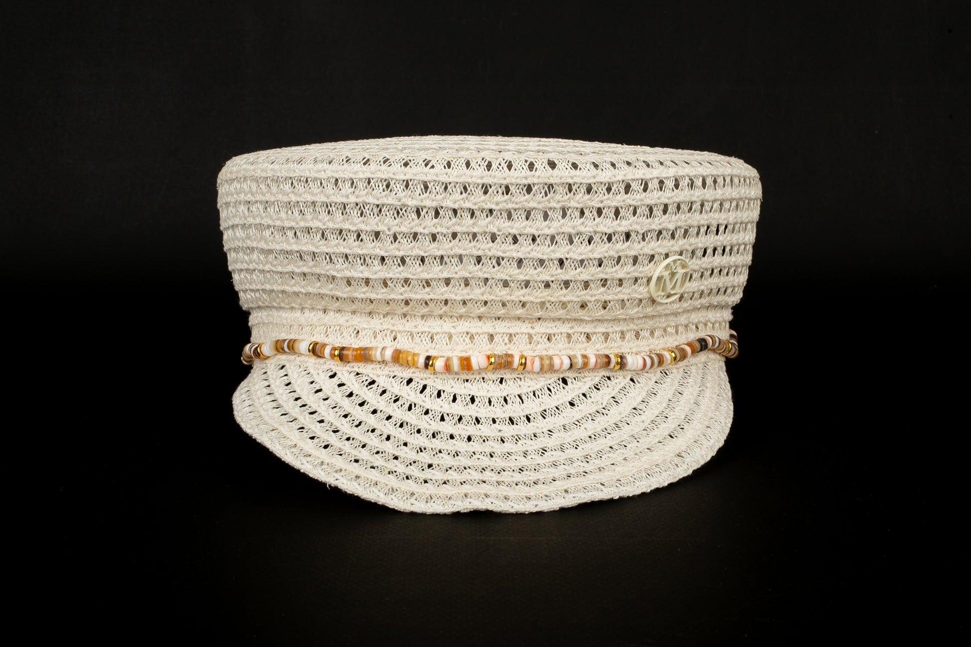 Maison Michel - (Made in Italy) Cotton and hemp cap edged with mineral stones. M size indicated.

Additional information:
Condition: Very good condition
Dimensions: Head circumference: 55 cm

Seller Reference: CHP37