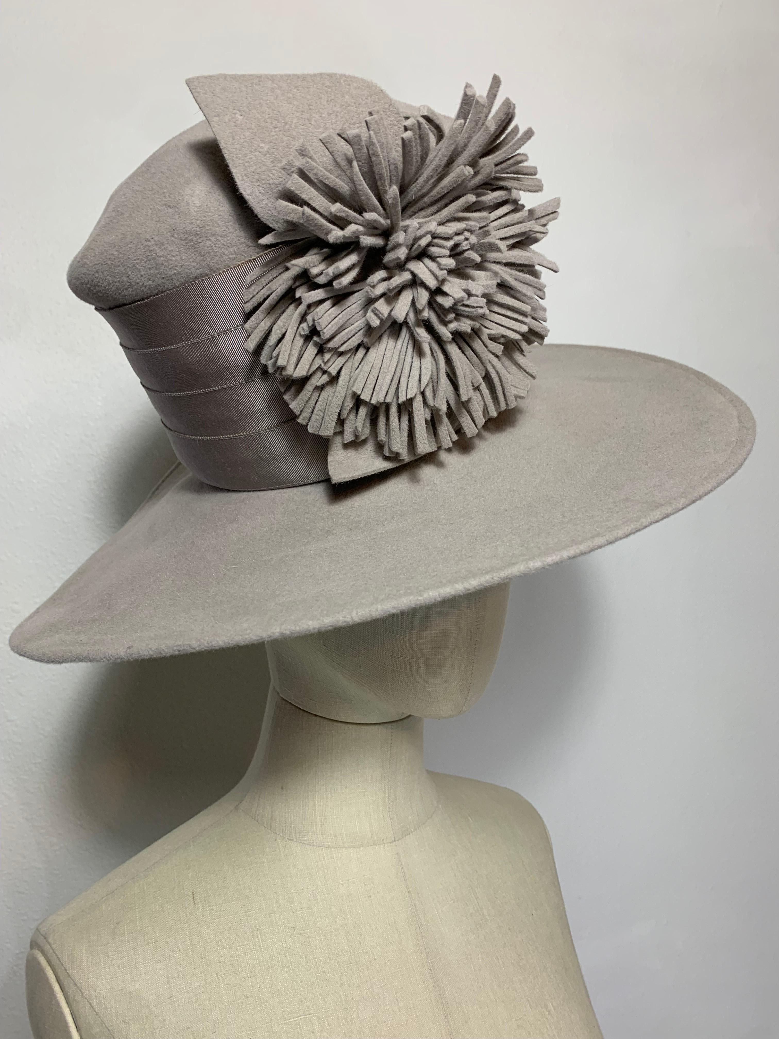 Maison Michel Autumn/Winter Medium Brim Dove Gray Felt  Beautifully Blocked High Top Hat with Matching Fringe Flower and Wide Grosgrain Band: Unlabeled, with attached combs for securing. Size 7 1/4 Medium. Made in France. 

Please visit our 1stDibs