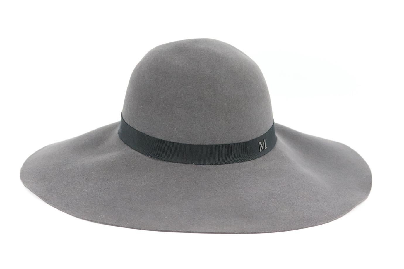 Maison Michel grosgrain trimmed wool felt fedora. Dark-grey and black. Pull on. 100% Wool; trim: 56% cotton, 44% viscose. Does not come with dustbag or box. Size: Medium. Circumference: 23.6 in. Brim Width: 5.1 in. Very good condition - No sign of