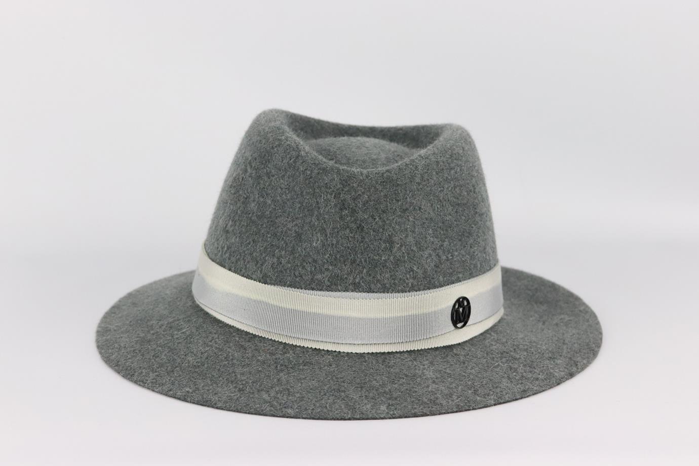 Maison Michel grosgrain trimmed wool felt fedora. Grey and black. Pull on. 100% Wool; trim: 56% cotton, 44% viscose. Does not come with dustbag or box. Size: Medium. Circumference: 23.6 in. Brim Width: 2.25 in. Very good condition - No sign of wear;