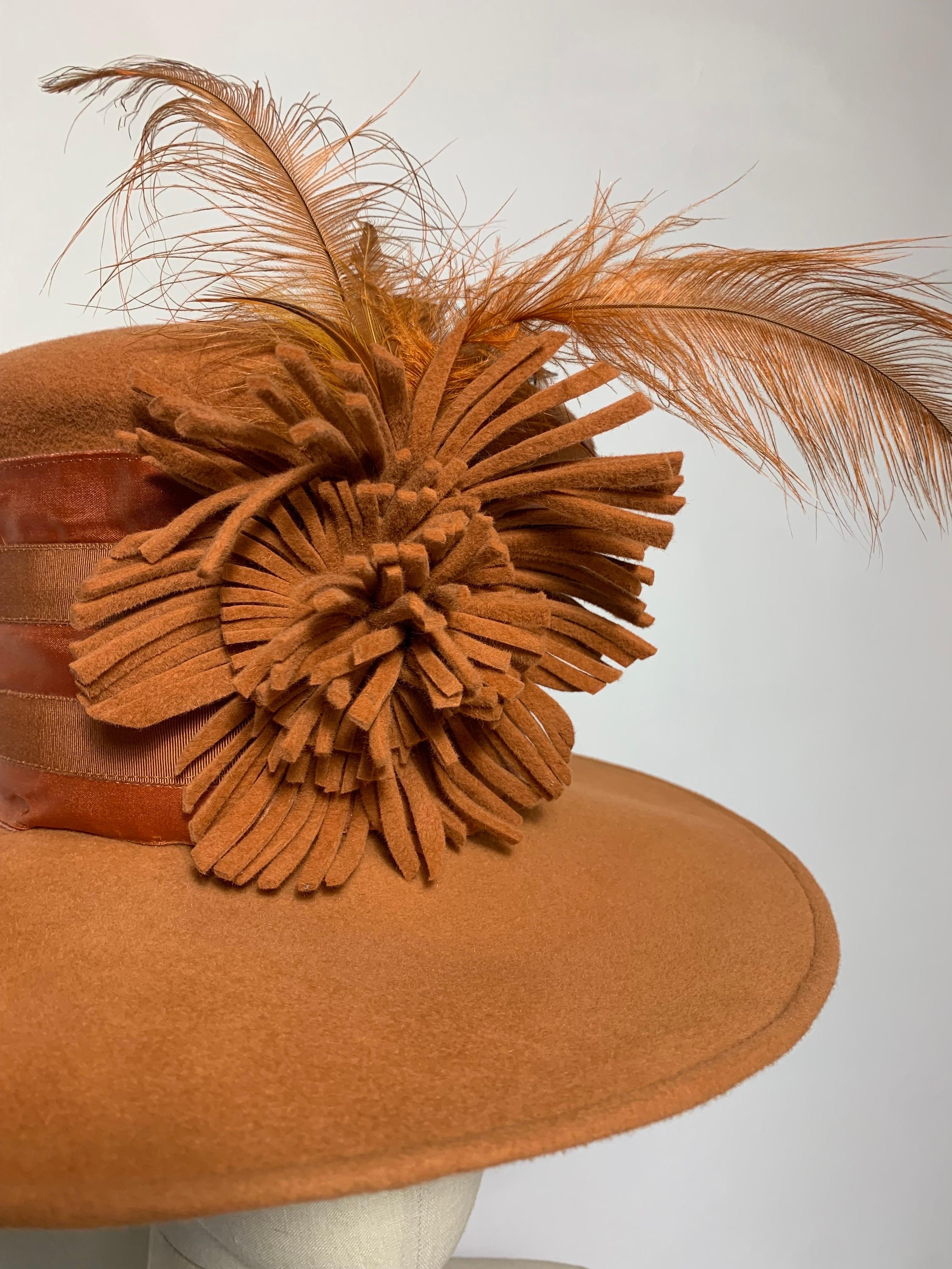 Maison Michel Autumn/Winter Medium Brim Copper Felt  Beautifully Blocked High Top Hat with Matching Flower, Feather and Wide Satin and Grosgrain Striped Band: Unlabeled, with attached combs for securing. Size 6 3/4 Medium. Made in France. 

Please