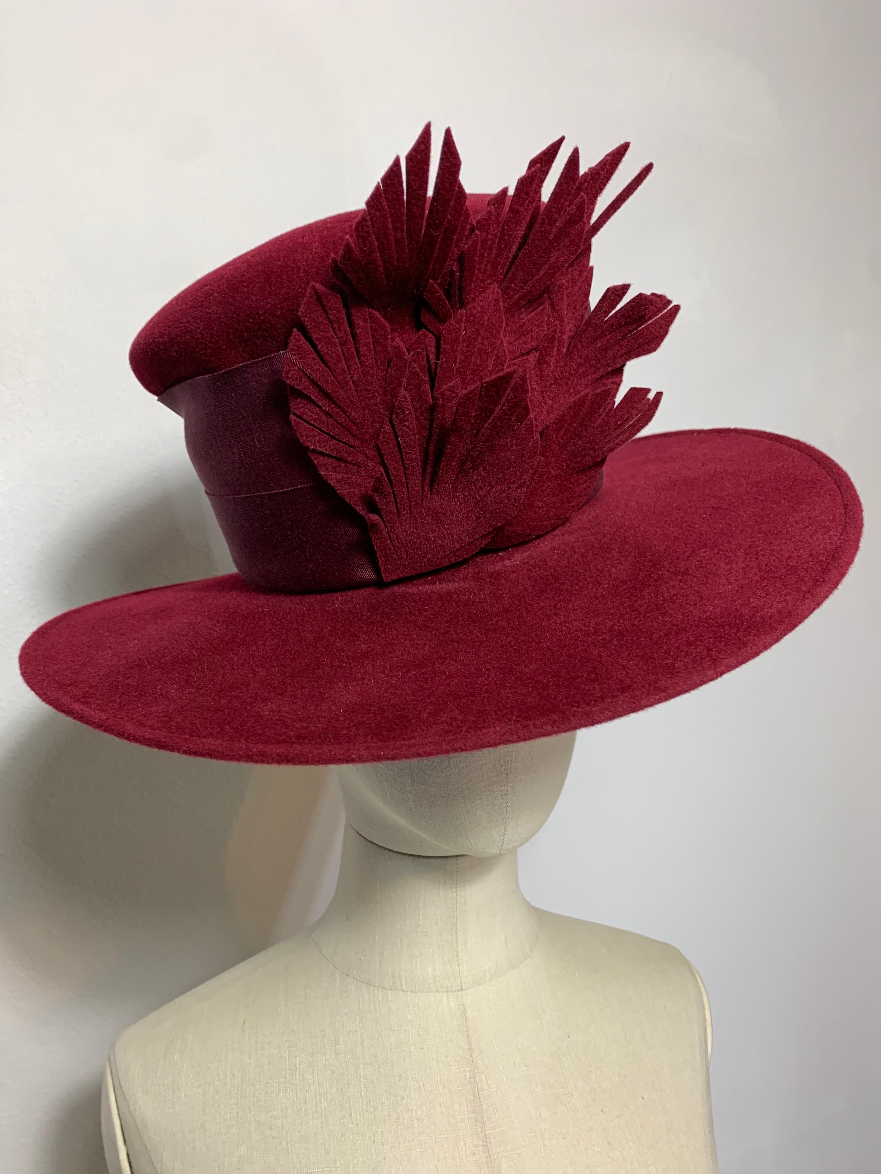Maison Michel Autumn/Winter Beautifully Blocked Medium Brim Maroon Felt High Top Hat with Matching Leaf Spray and Wide Grosgrain Band: Unlabeled, with attached combs for securing. Size 7 1/4 Medium. Made in France. 

Please visit our 1stDibs Store