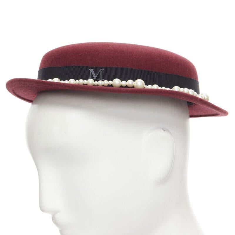 MAISON MICHEL Melanie Pearles burgundy red wool felt topper fedora hat 54cm
Reference: MELK/A00155
Brand: Maison Michel
Material: Wool
Color: Burgundy
Pattern: Solid
Extra Details: Faux pearl embellishment.

CONDITION:
Condition: Unworn in mint
