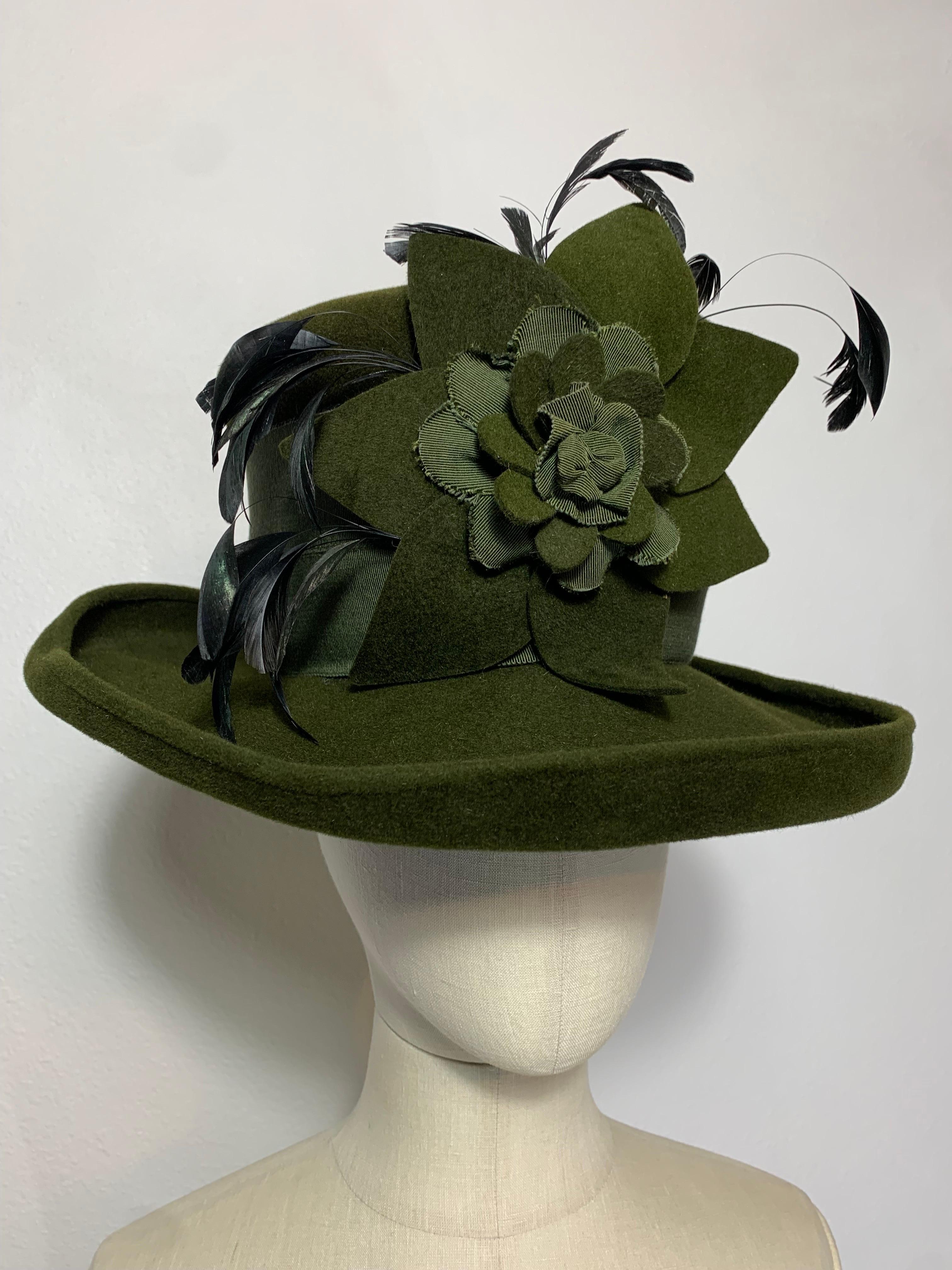 Maison Michel Autumn/Winter Medium Turned-Up Brim Olive Green Felt  Beautifully Blocked High Top Hat with Matching Flower, Feathers and Wide Grosgrain Band: Unlabeled, with attached combs for securing. Size 7 Medium. Made in France. 

Please visit