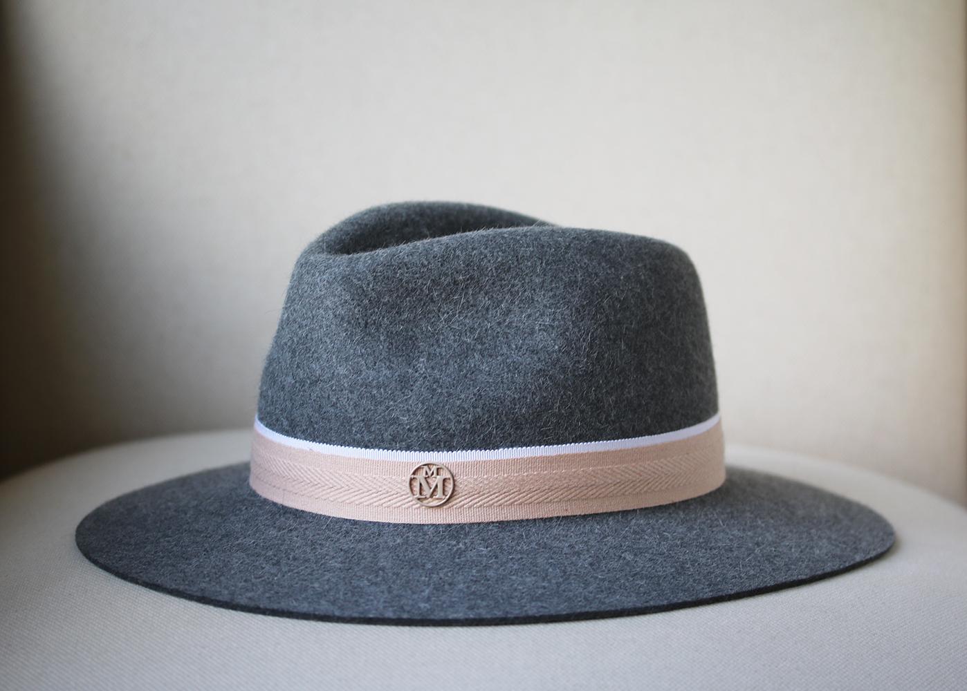 Swap your classic black fedora for Maison Michel's pretty marl-grey 'Rico' style. It's handcrafted from soft rabbit-felt and is trimmed with two layers of blush and white grosgrain. Marl-grey rabbit-felt. 100% rabbit-felt; trim: 100% cotton. 

Size: