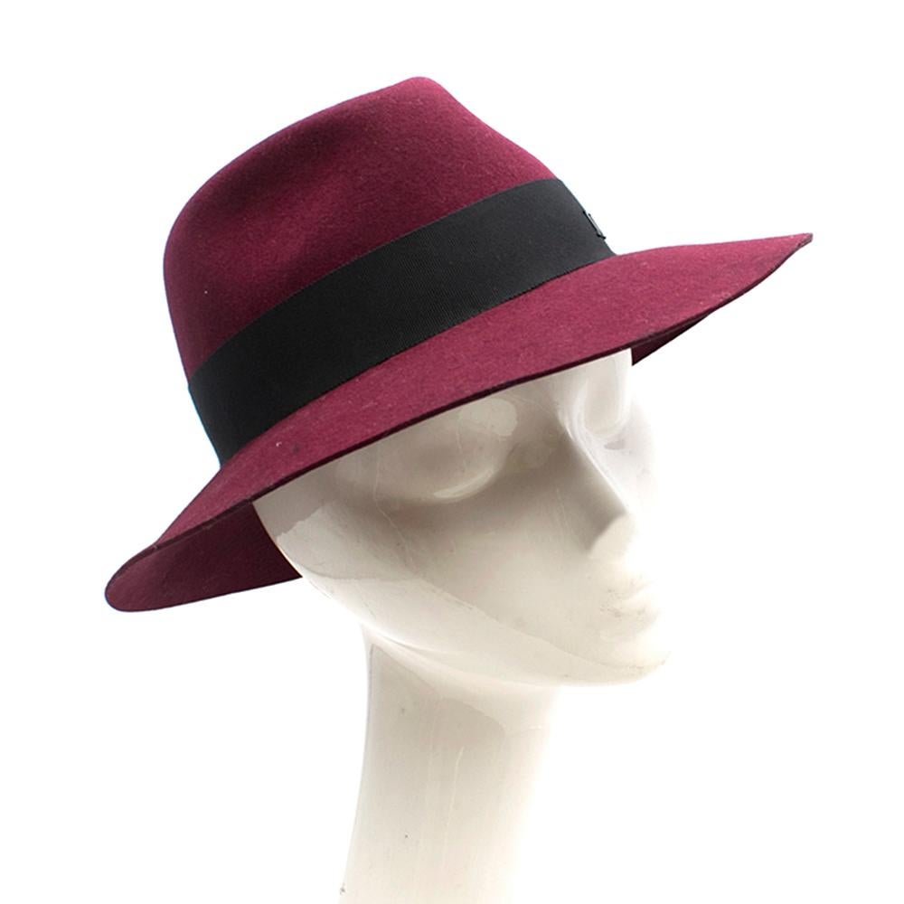 Maison Michel Burgundy Red Fedora

-Virginie model
-In red burgundy wool felt
-Grosgrain ribbon with 'M' logo
-With a box 

Please note, these items are pre-owned and may show signs of being stored even when unworn and unused. This is reflected