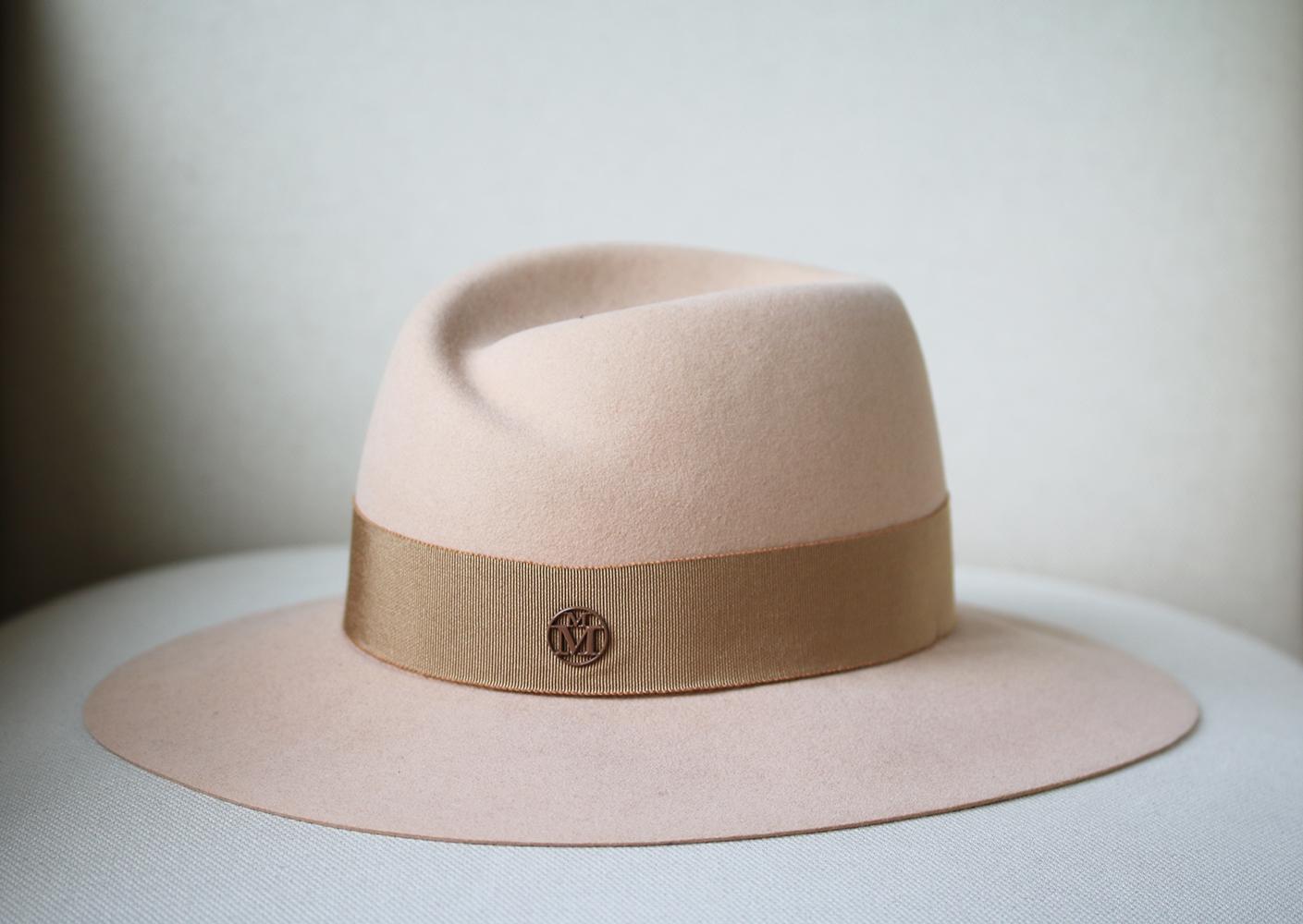 Swap your classic black fedora for Maison Michel's pretty light brown/beige 'Virginie' style. It's handcrafted from soft rabbit-felt and is trimmed with a tonal grosgrain ribbon. Light brown/beige rabbit-felt. 100% rabbit-felt; trim: 100% cotton.