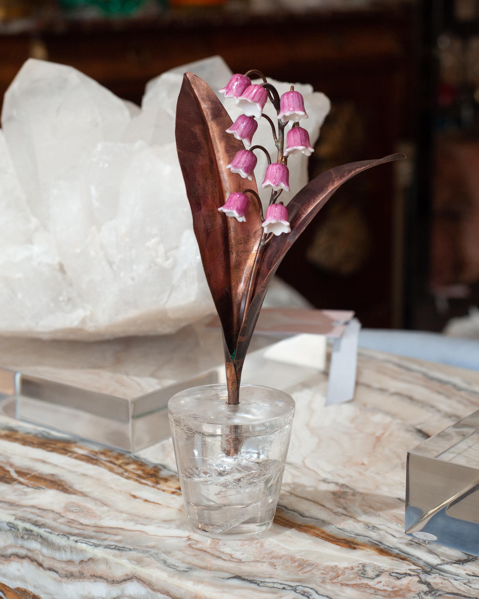 Enhance your table with these delicate porcelain flowers by French artist Samuel Mazy, in collaboration with Maison Nurita. This Lily of the Valley is handmade in biscuit porcelain, glazed in a custom pink for Maison Nurita, with patinated copper
