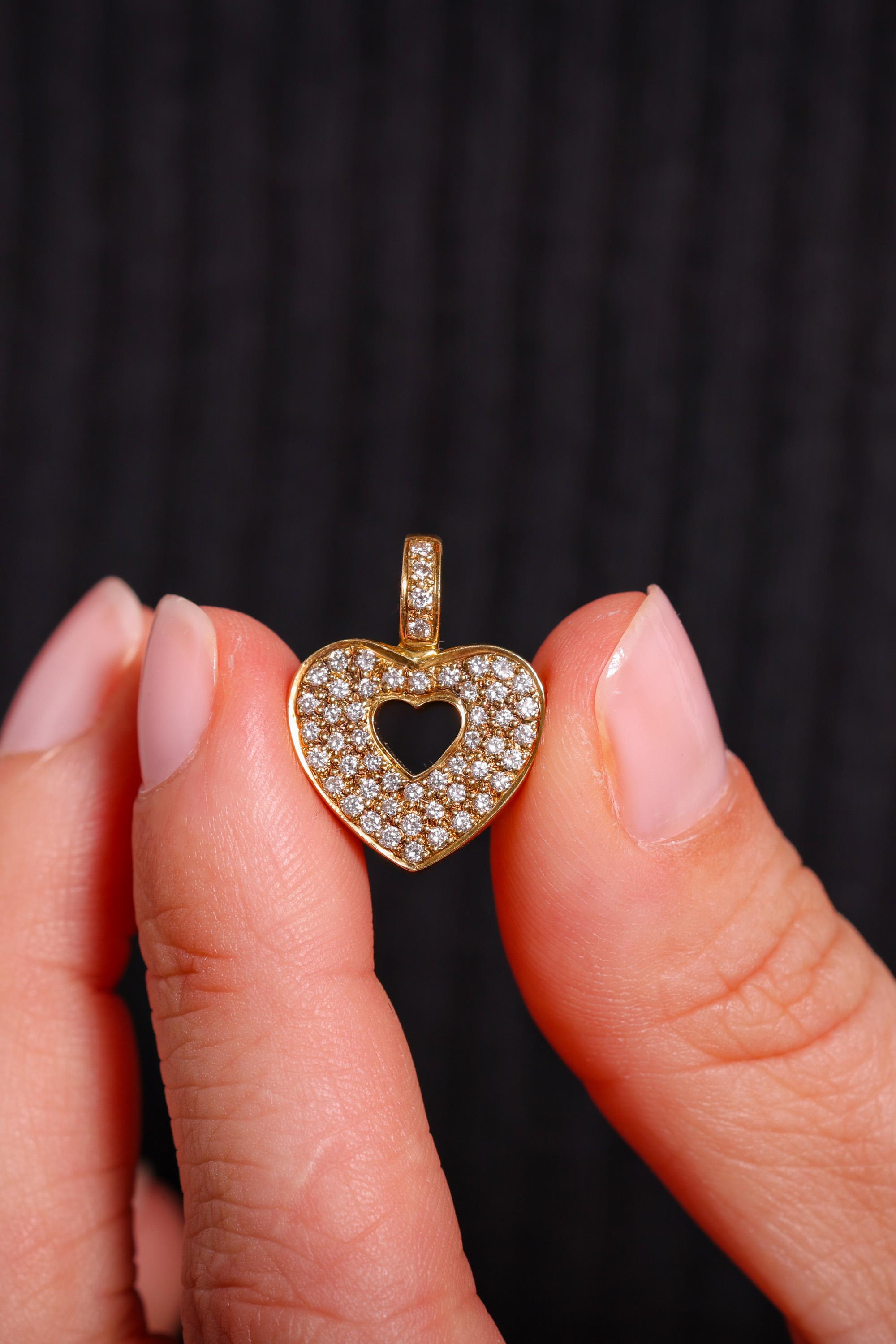 Brand: Maison Poiray
Center Stone: 52 Diamonds
Cut: Round Brilliant Cut
Weight: Approximately .5 Carats
Color: G
Clarity: SI
Metal: 18K Yellow Gold
Era: Vintage
Circa: 1980s
Hallmarks: French Eagle Head, Signed, Numbered and Makers Marks
Size: 7/8 x