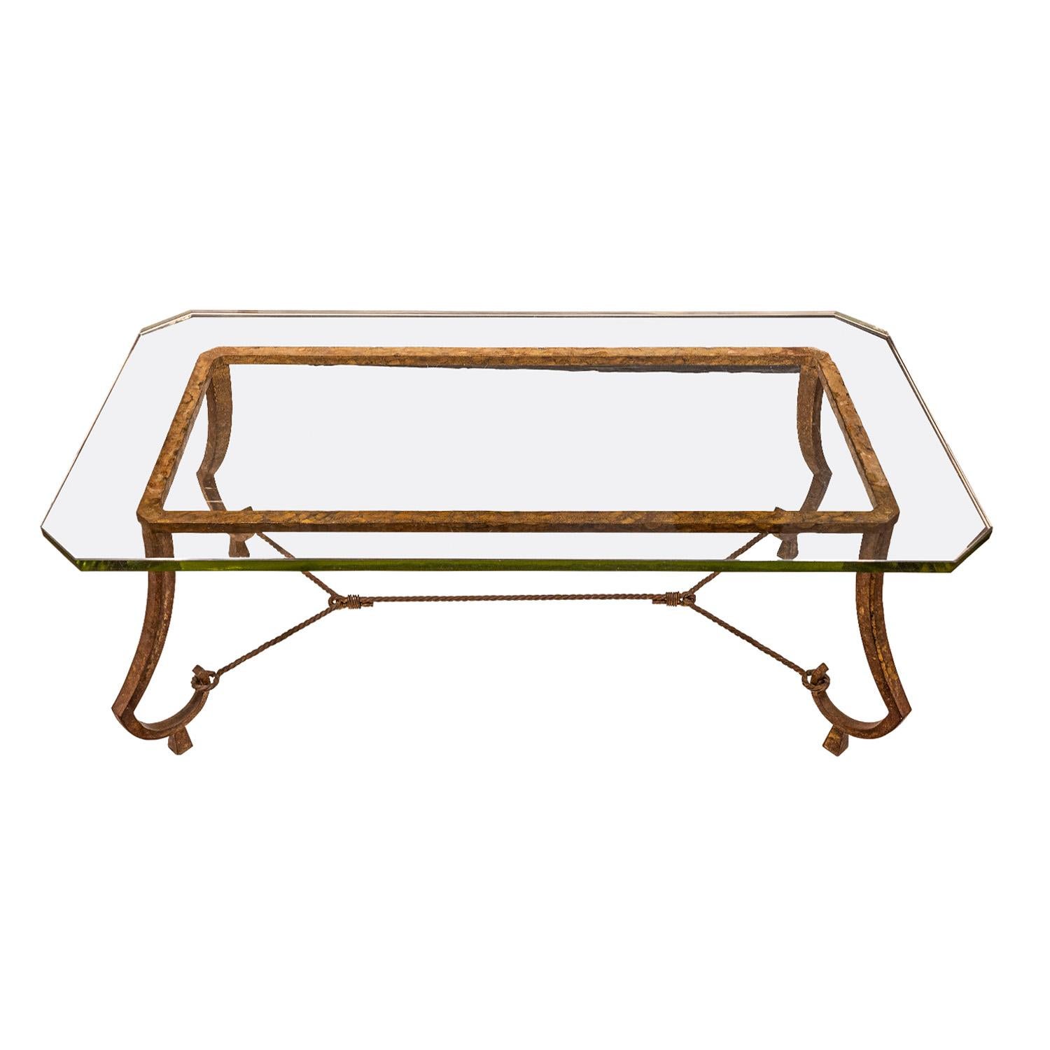 Artisan coffee table, gilt wrought iron with original glass top, by Maison Ramsay, France 1940's. This table is beautifully made and is very chic.