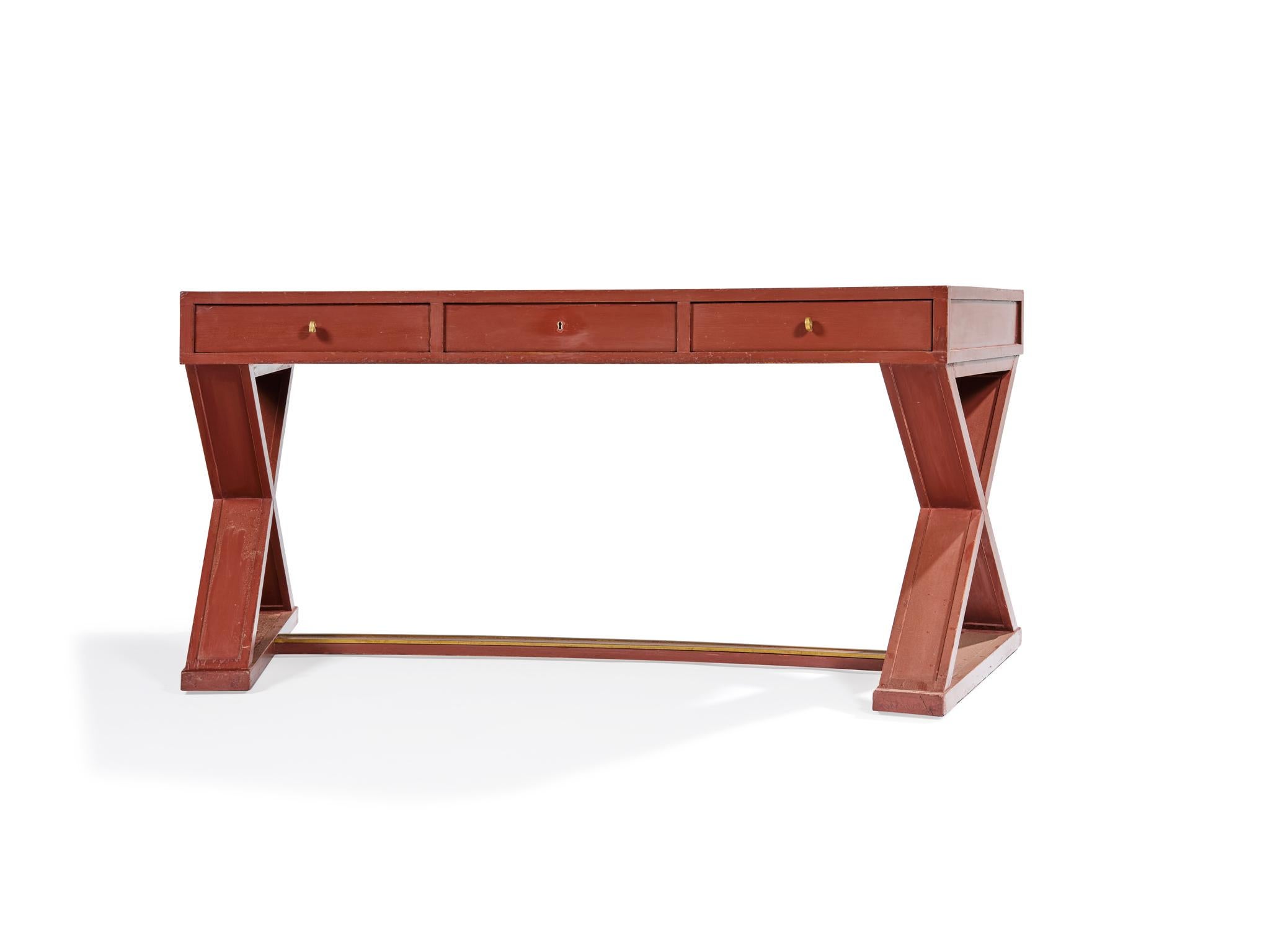 Maison Ramsay ( attributed) around 1950.

Curved desk with red ocher laquered.
Brass thread on the crosspiece.

H. 76,5 x L. 170 cm x P. 70 cm.