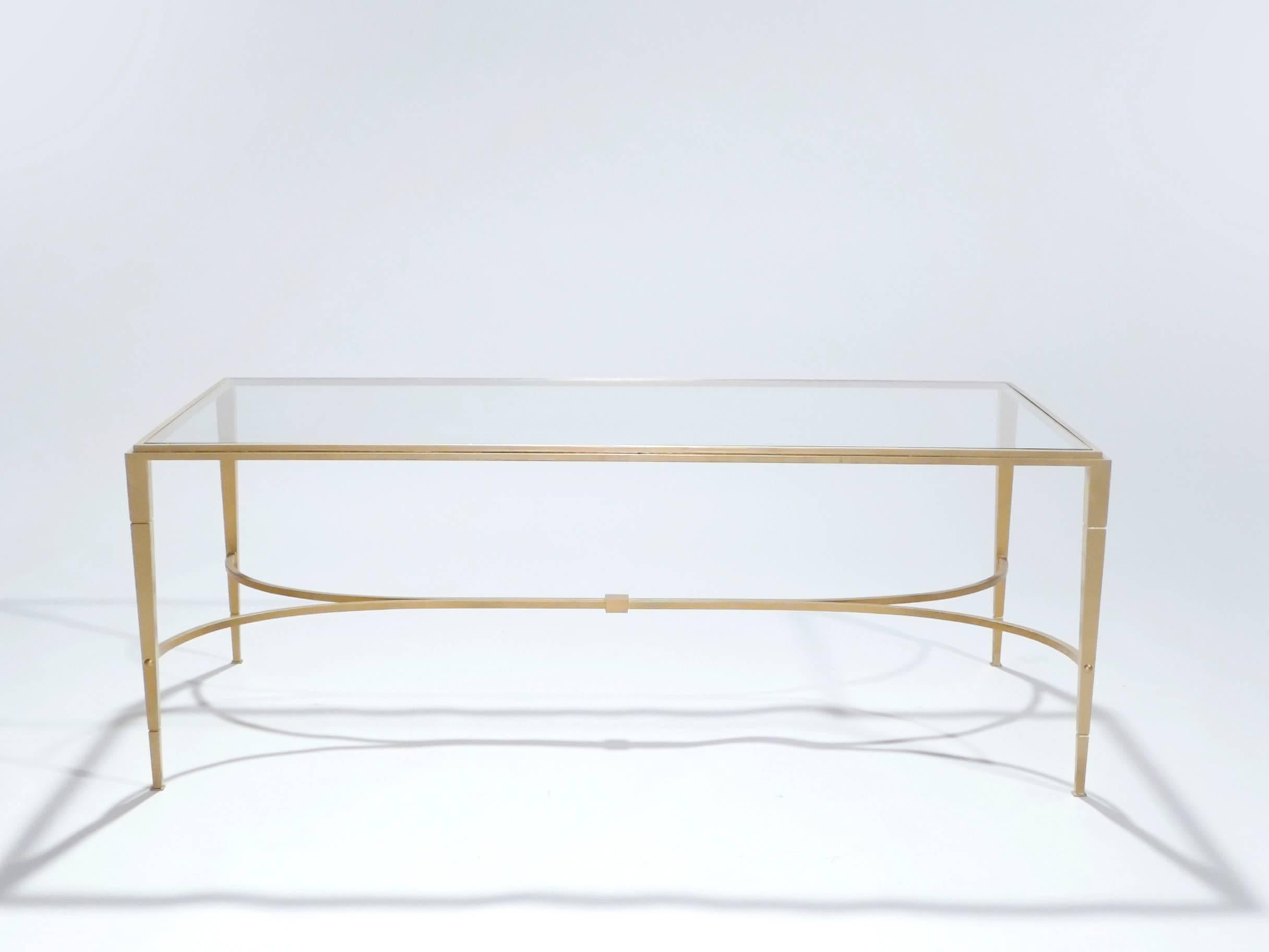 Grace your home with the true elegance of this coffee table by Maison Ramsay from 1960s. Glittering in an antiqued gold gilt finish, this iron craft coffee table adds a glam twist which makes a gracious compliment to both traditional and modern