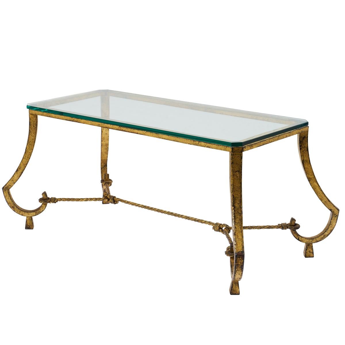 A vintage find from France, this petite bronze and glass coffee table has elegant lines and chic rope detailing.