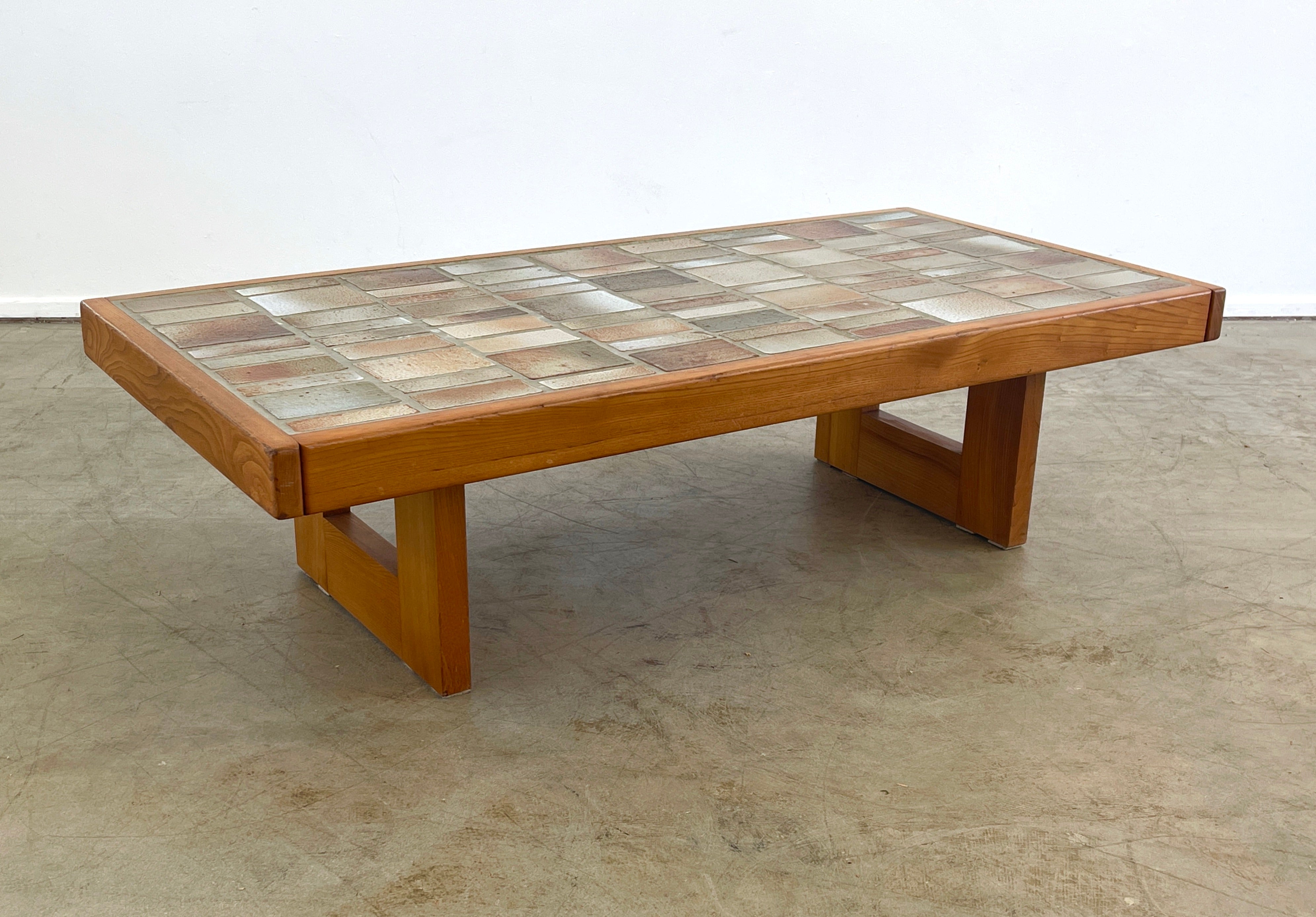 Ceramic tile coffee table in beautiful neutral tones by Maison Regain, circa 1970s

Elm wood frame.