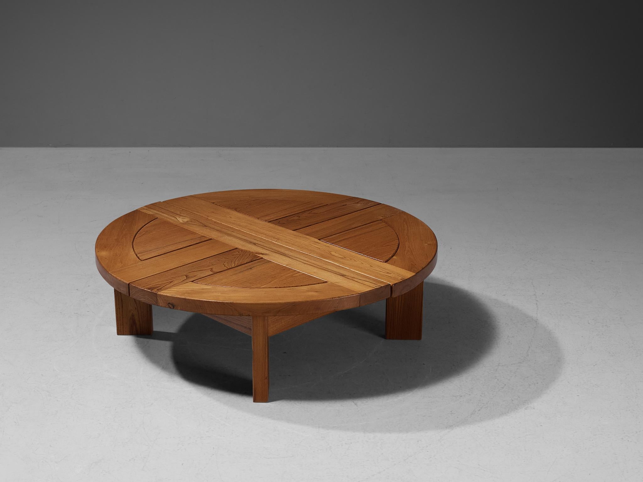 Maison Regain, coffee table, elm, France, 1970s.

Stunning French coffee table executed in a rich and beautifully colored elm, designed by Maison Regain. The table is sturdy and combines a simplified yet complex design with nifty, solid construction