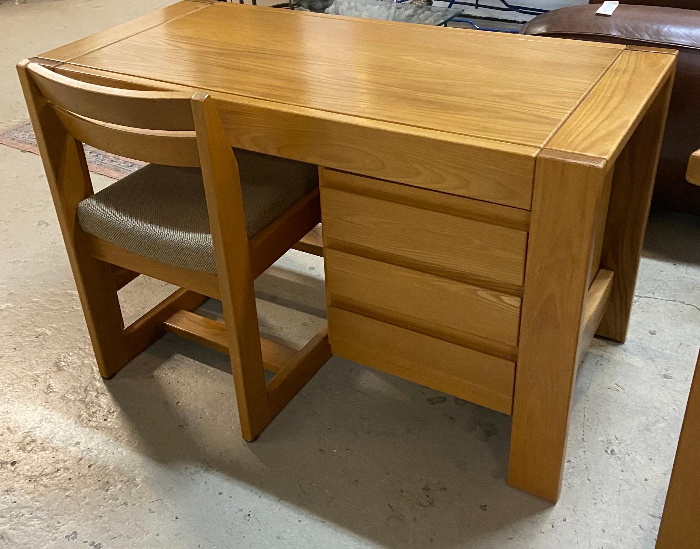 An elm desk with his chair from Maison regain circa 1980.