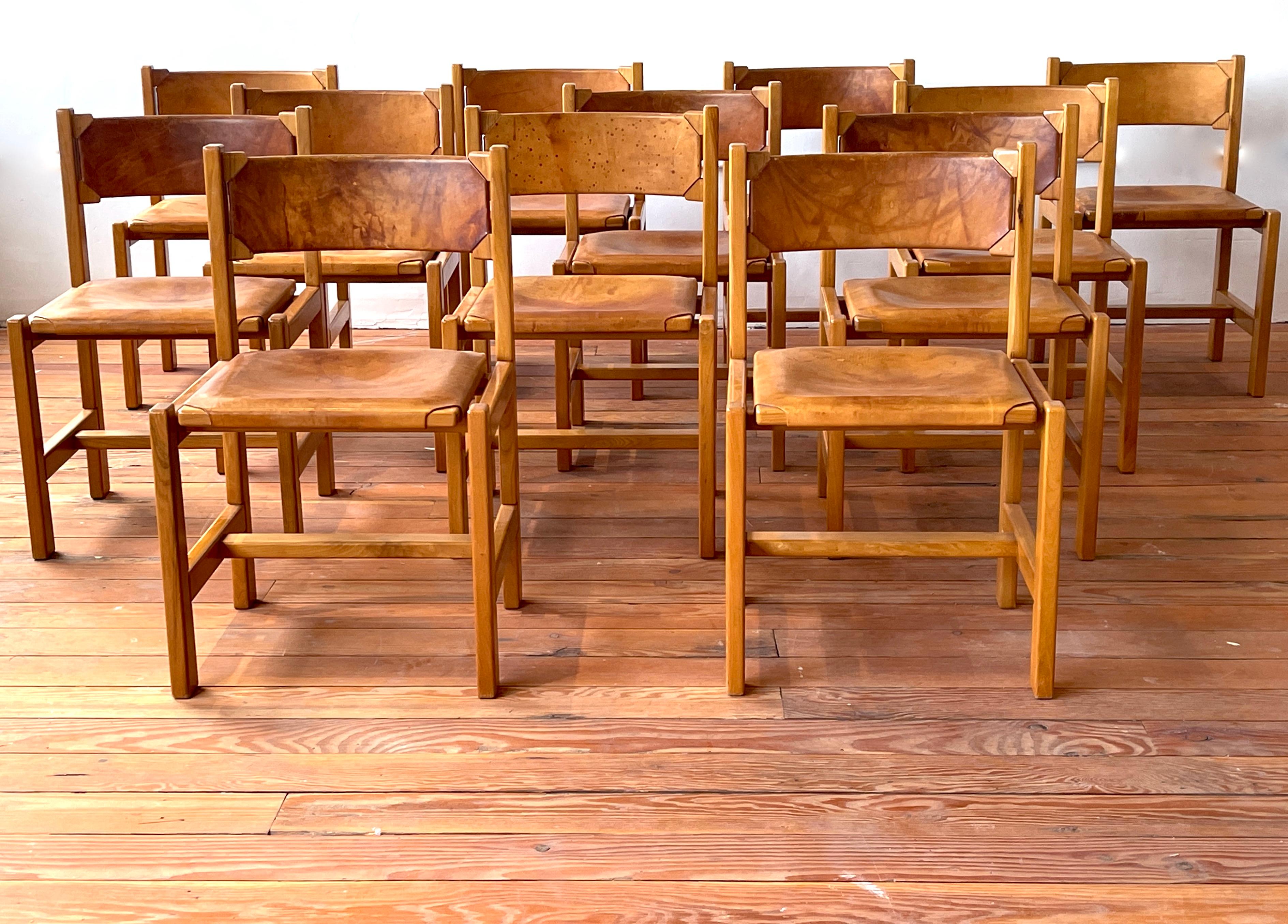 Maison Regain dining chairs with great patina's leather seats 
Set of 12 available
Priced individually 
France, 1970s.