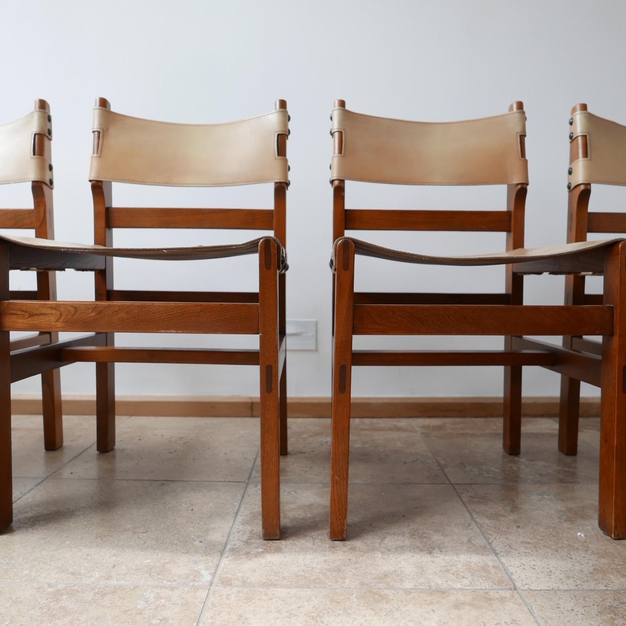 A set of six elm dining chairs by Maison Regain.

Typically good quality evidenced by the workmanship on the Elm wood.

The leather remains in generally very good condition with the occasional scuff to be expected with age,

circa 1970s,
