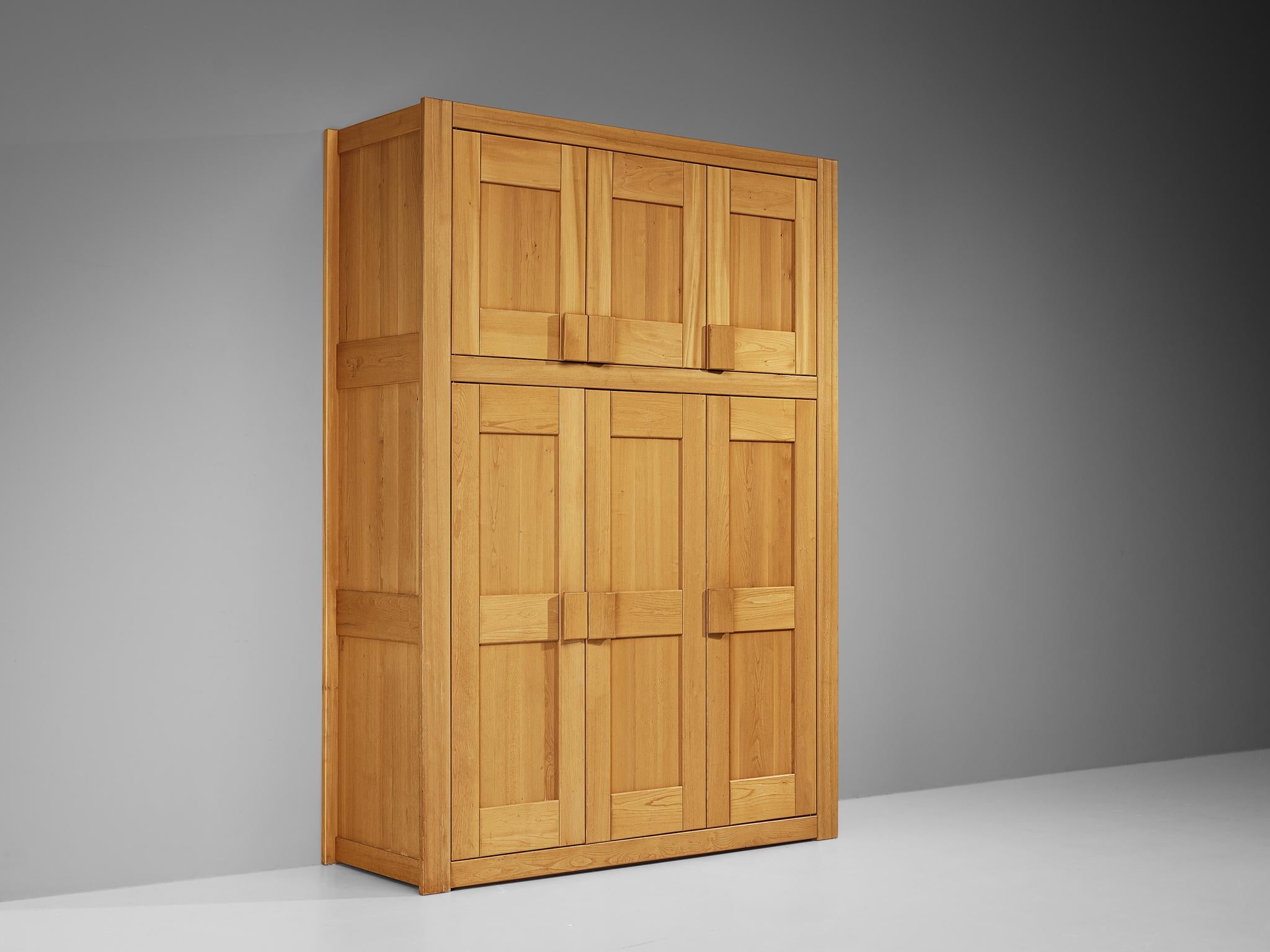 Maison Regain, wardrobe, solid elm, brass, France, 1970s

A rare armoire designed and crafted by Maison Regain. The wardrobe is sturdy and combines a simplified yet complex design with nifty, solid construction details that characterize Maison