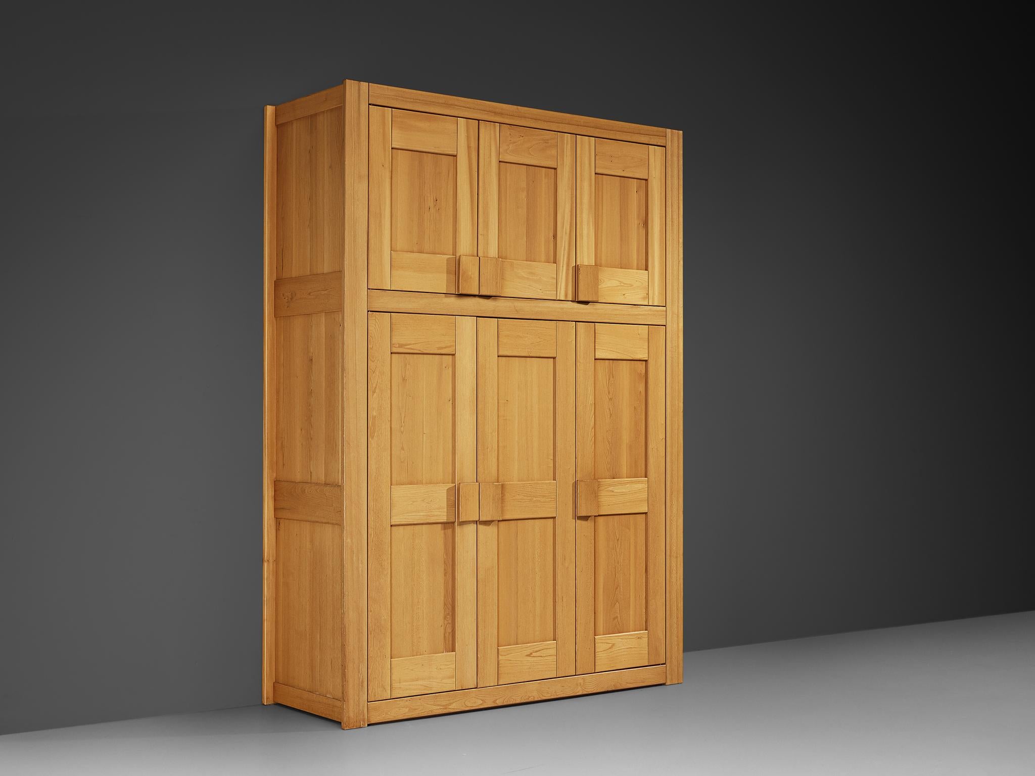 Maison Regain, wardrobe, solid elm, brass, France, 1970s

A rare armoire designed and crafted by Maison Regain. The wardrobe is sturdy and combines a simplified yet complex design with nifty, solid construction details that characterize Maison