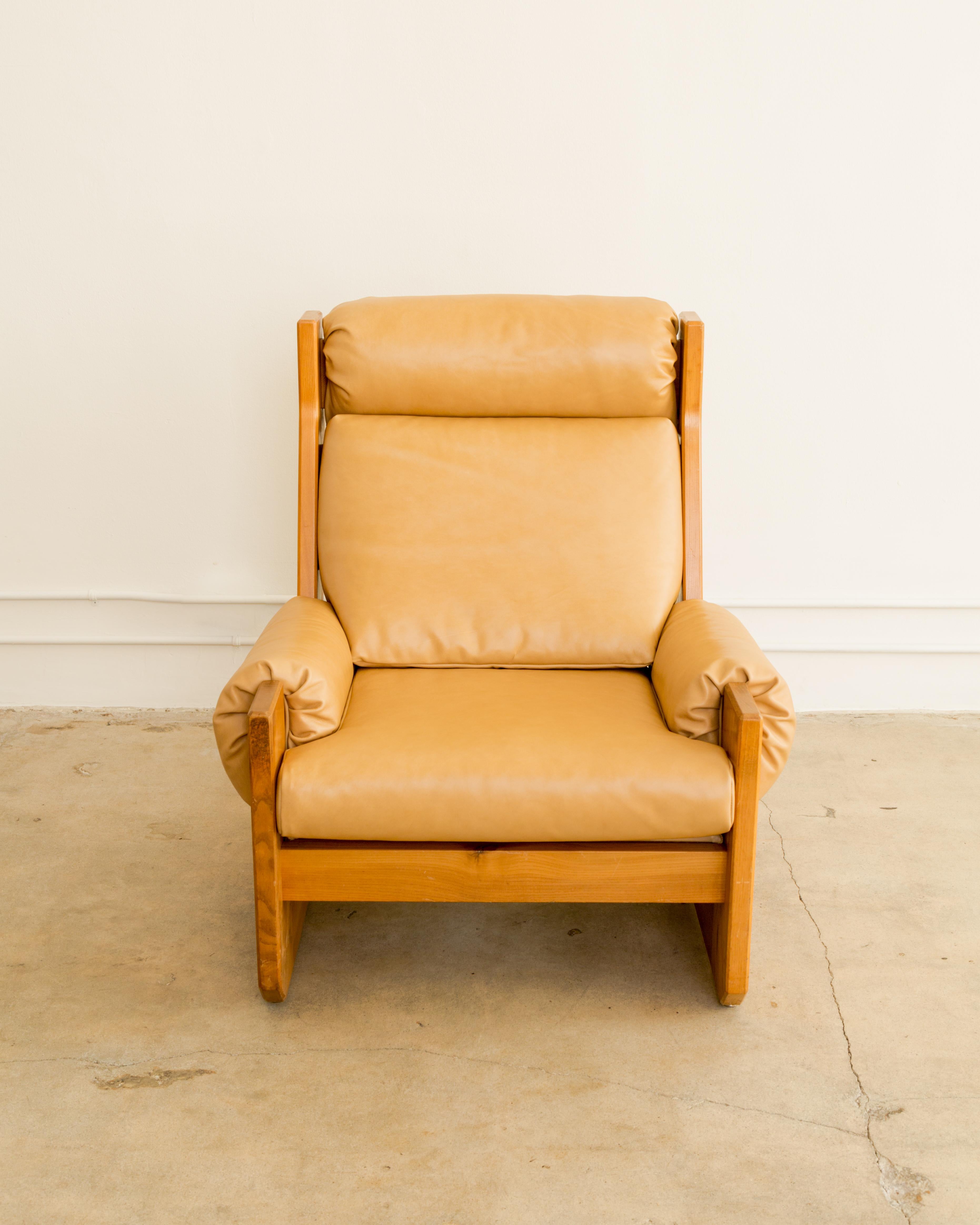 High back leather and elm wood club chair, newly leather upholstery and fill, by Maison Regain, solid, sturdy and stylish, France circa 1960's.
