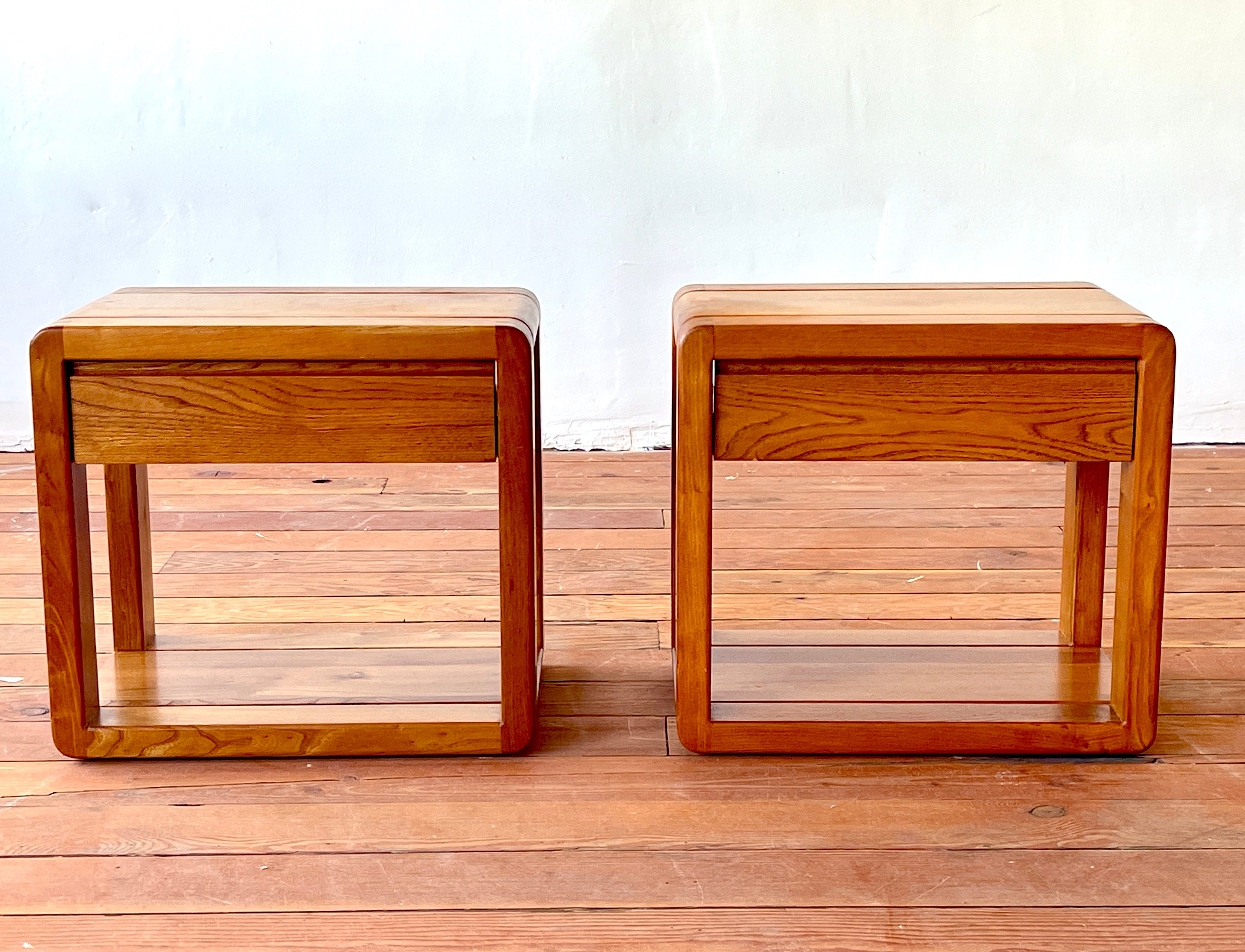 French elm nightstands / end tables by Maison Regain
Sleek simple design with curved ends and single drawer for storage.