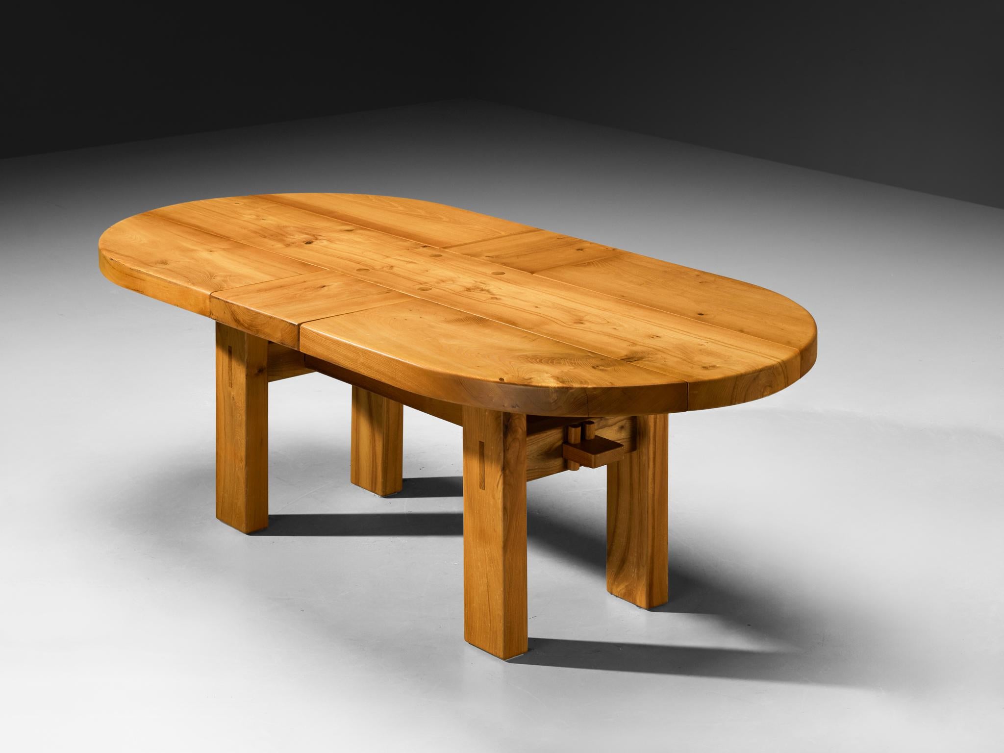 Maison Regain, dining room table, solid elm, France, 1970s

This exquisite oval dining table by Maison Regain is a stunning piece of furniture showing beautiful design and craftsmanship. The base, characterized by its clear lines and symmetrical