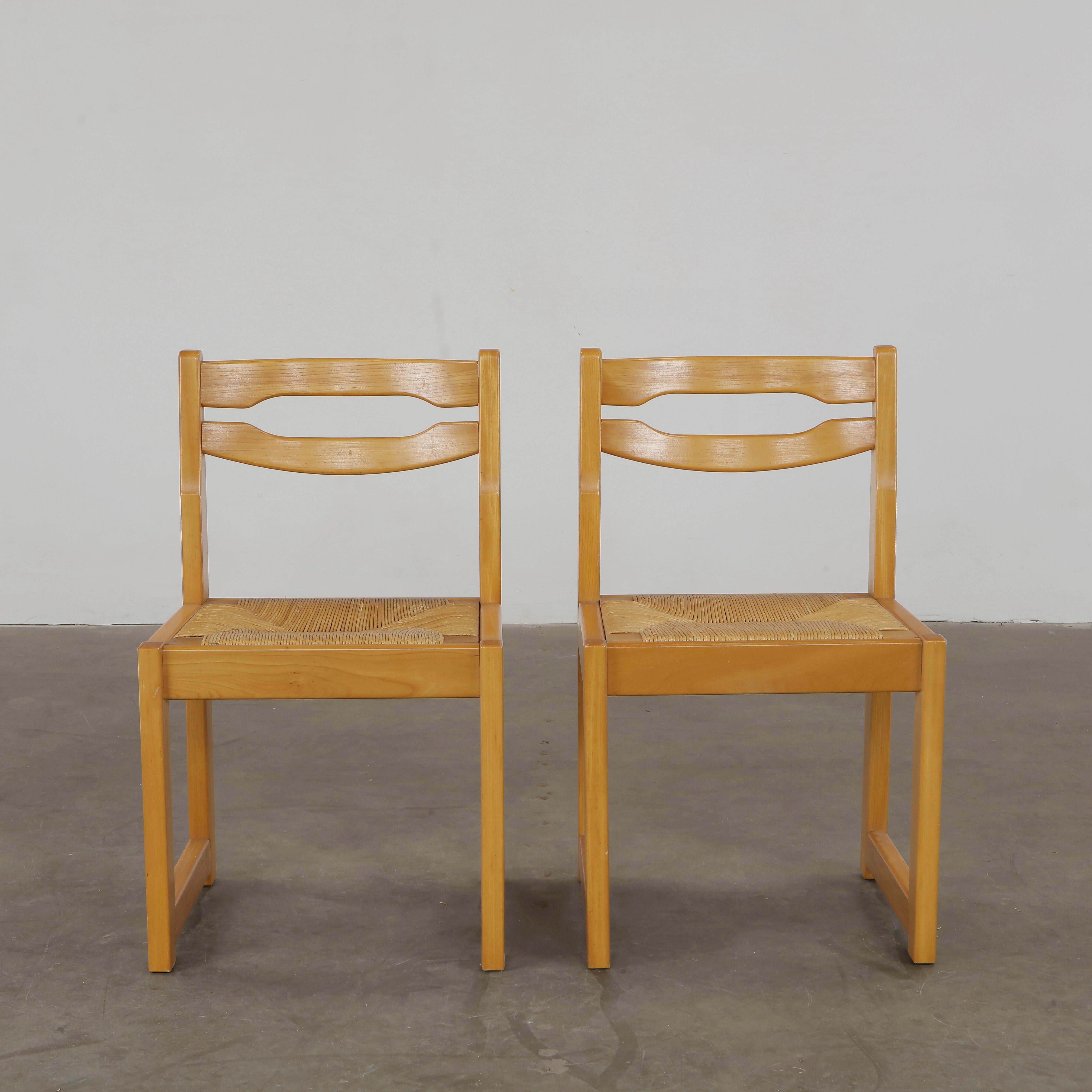 Minimalist lines meet Provençal craftsmanship in this classic set by Maison Regain. Height: 31 in. Width: 18.5 in. Depth: 17 in. Seat Depth: 16.5 in. Seat Height: 18.5 in.