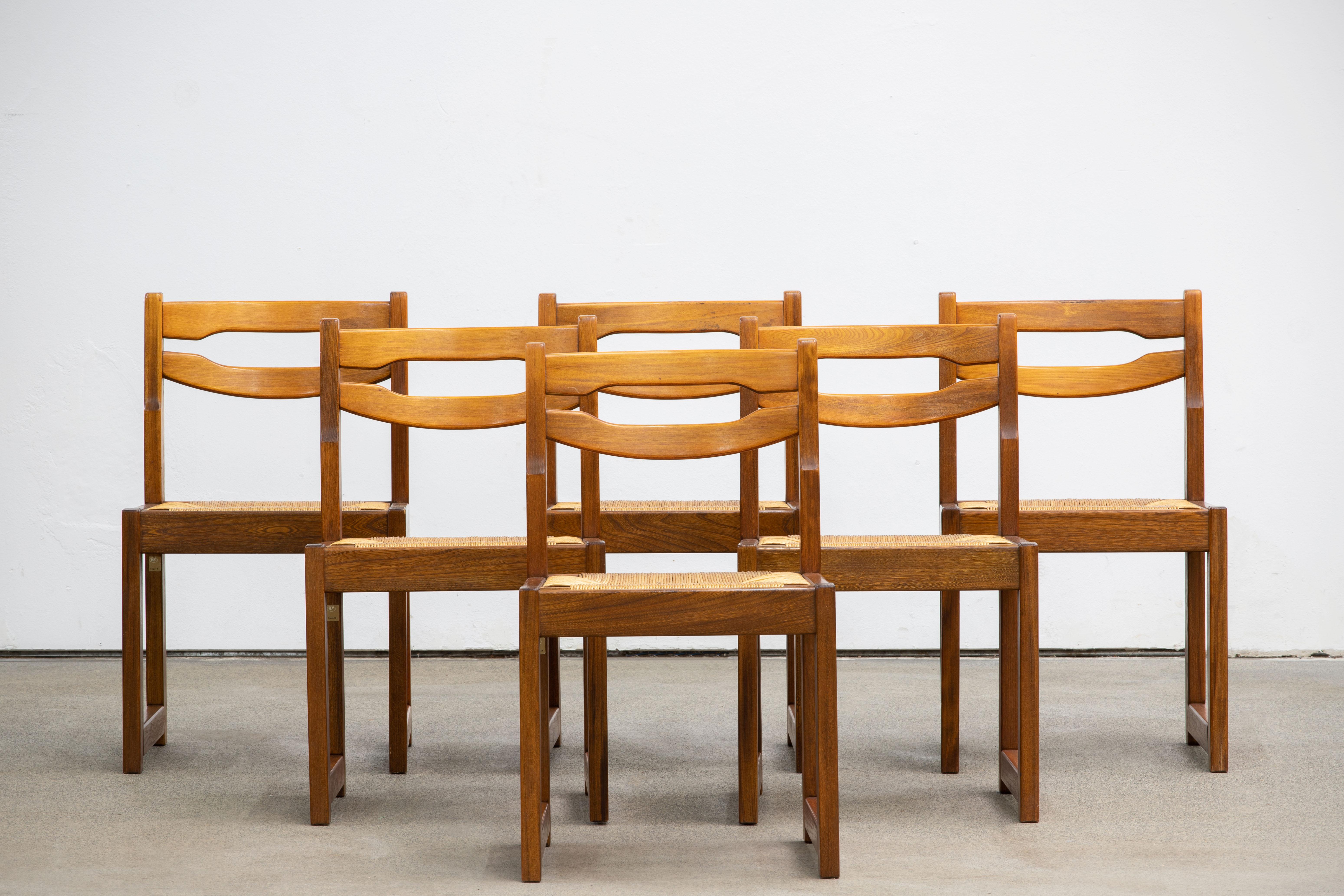 Those impressive chairs were produced by Maison Regain in France in the late 1970s. They are made in solid elmwood and cord. The very solid construction and the attractive grain of the elm wood complete the striking design. The pieces are in very