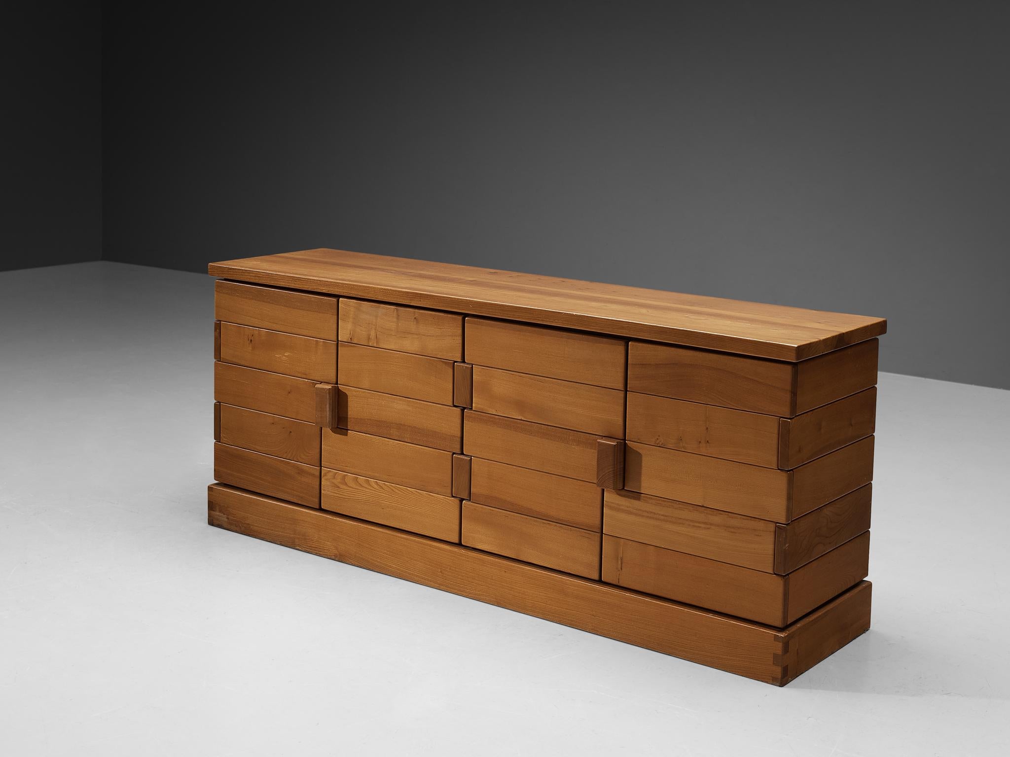 Maison Regain, sideboard, solid elm, metal, France, 1970s

This sideboard by Maison Regain has a strong decorative look. Horizontal slats in different lengths structure the front and are joined by two rectangular handles. The rhythmic doors give