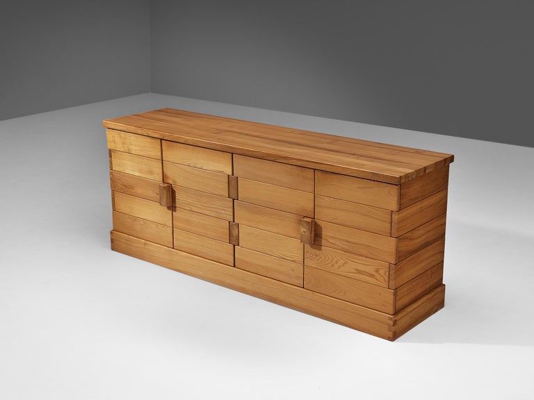 Maison Regain, sideboard, solid elm, metal, France, 1970s

Stunning French cabinet executed in solid elm, designed by Maison Regain. The sideboard is sturdy and combines a simplified yet complex design with nifty, solid construction details that