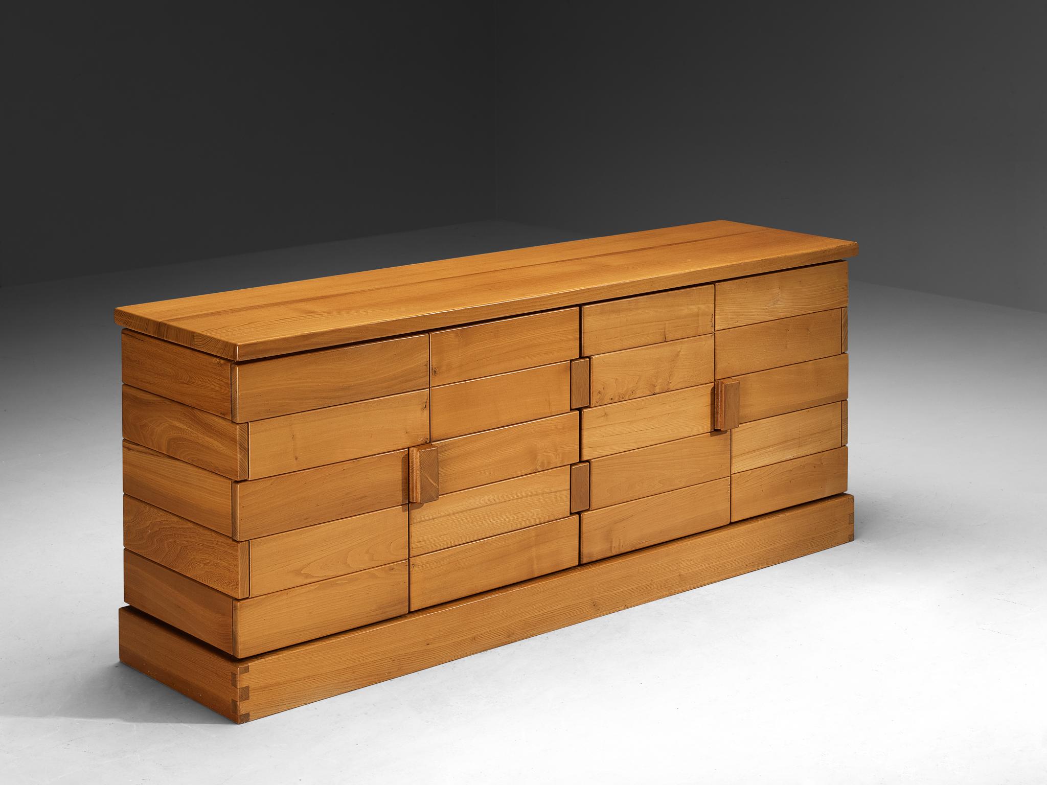 Maison Regain, sideboard, solid elm, France, 1970s

Stunning French cabinet executed in solid elm, designed by Maison Regain. The sideboard is sturdy and combines a simplified yet complex design with nifty, solid construction details that