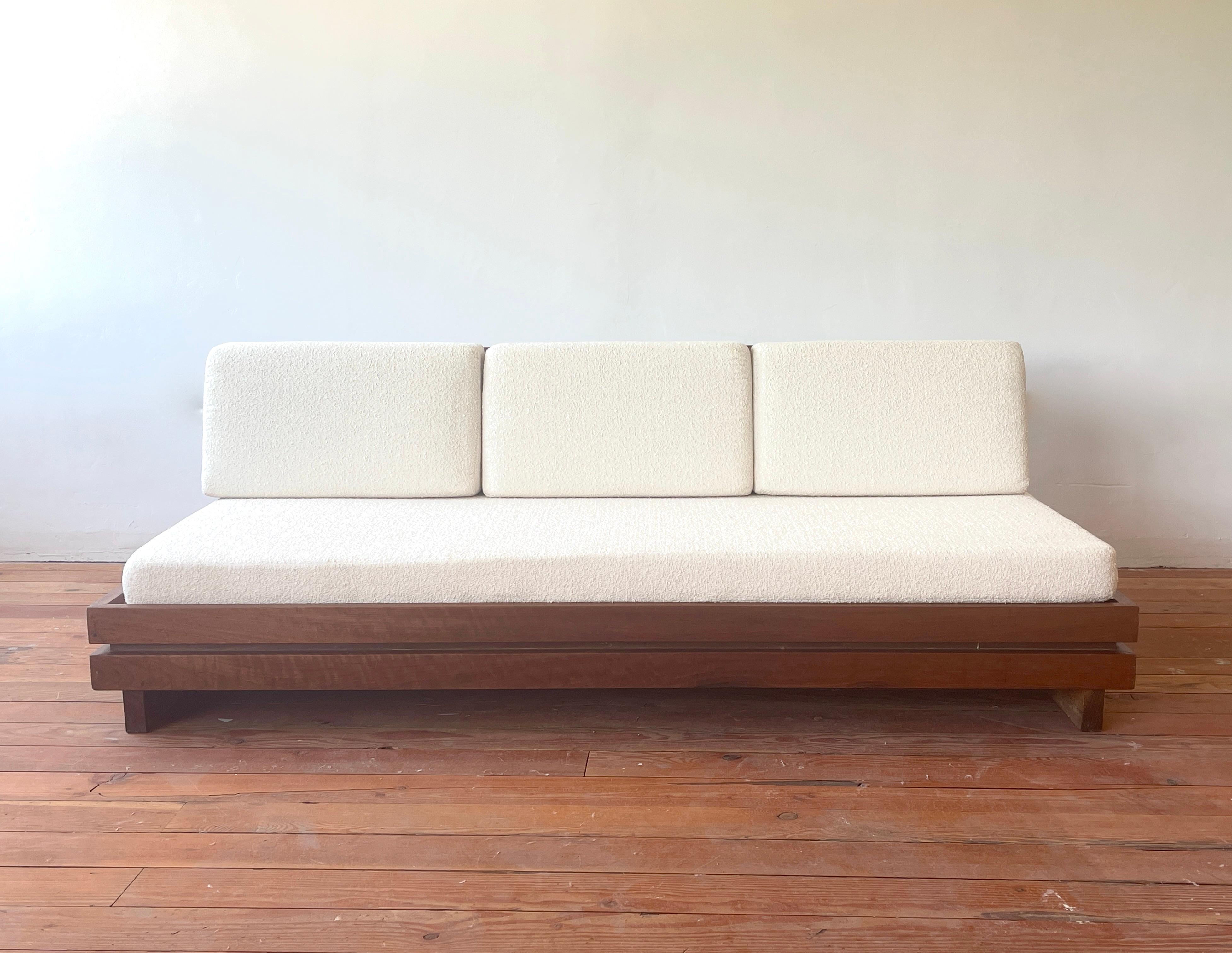 Large bench seat sofa produced in the 1970s by Maison Regain
Solid construction in elm wood reminiscent of Pierre Chapo. 
Beautiful grain to wood - simple lines
Newly upholstered seat and back cushion in white linen from France.