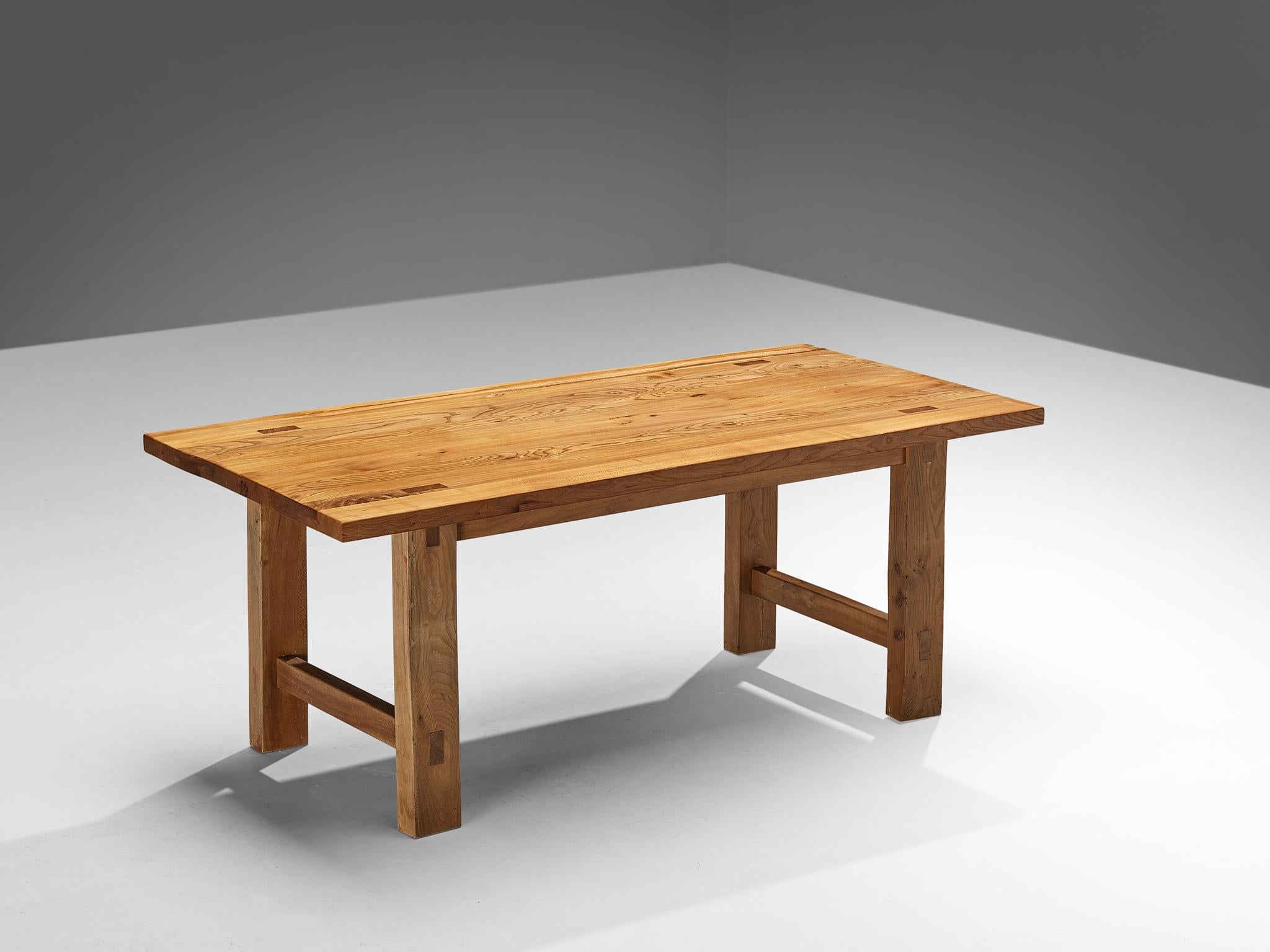 Maison Regain, dining room table, solid elm, France, 1970s

Beautiful dining table by Maison Regain. The base is expressed through clear lines and symmetrical features. The strict angular and open look of the base balances out the density of the