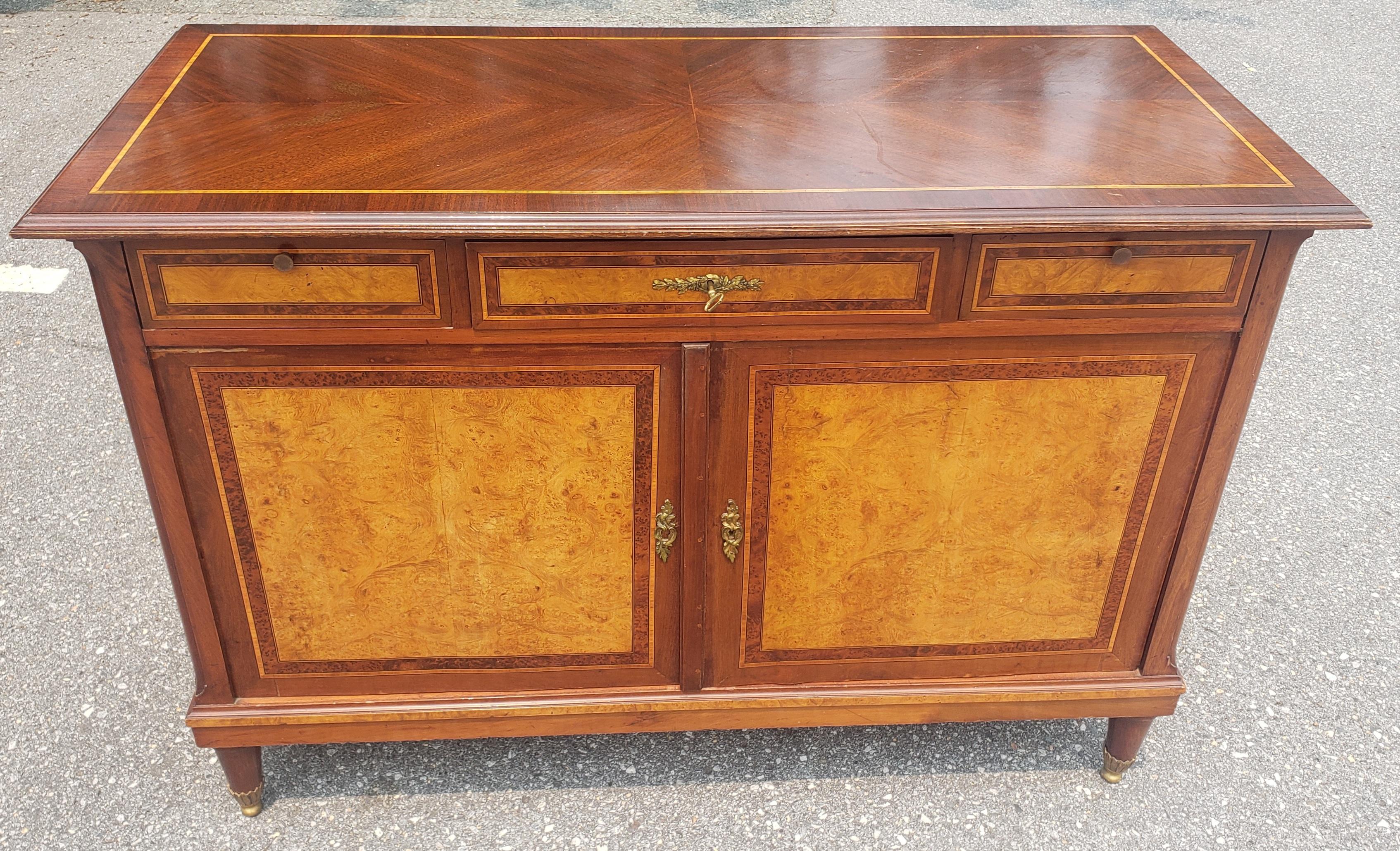 A very fine French Maison Soubrier Louis XV style Mixed woods and Burl  with Satinwood Marquetry Buffet in great vintage condition, Circa 1920s. Proportionate size, convenient for medium to smaller spaces. Surrounded with Fine inlays and marquetry