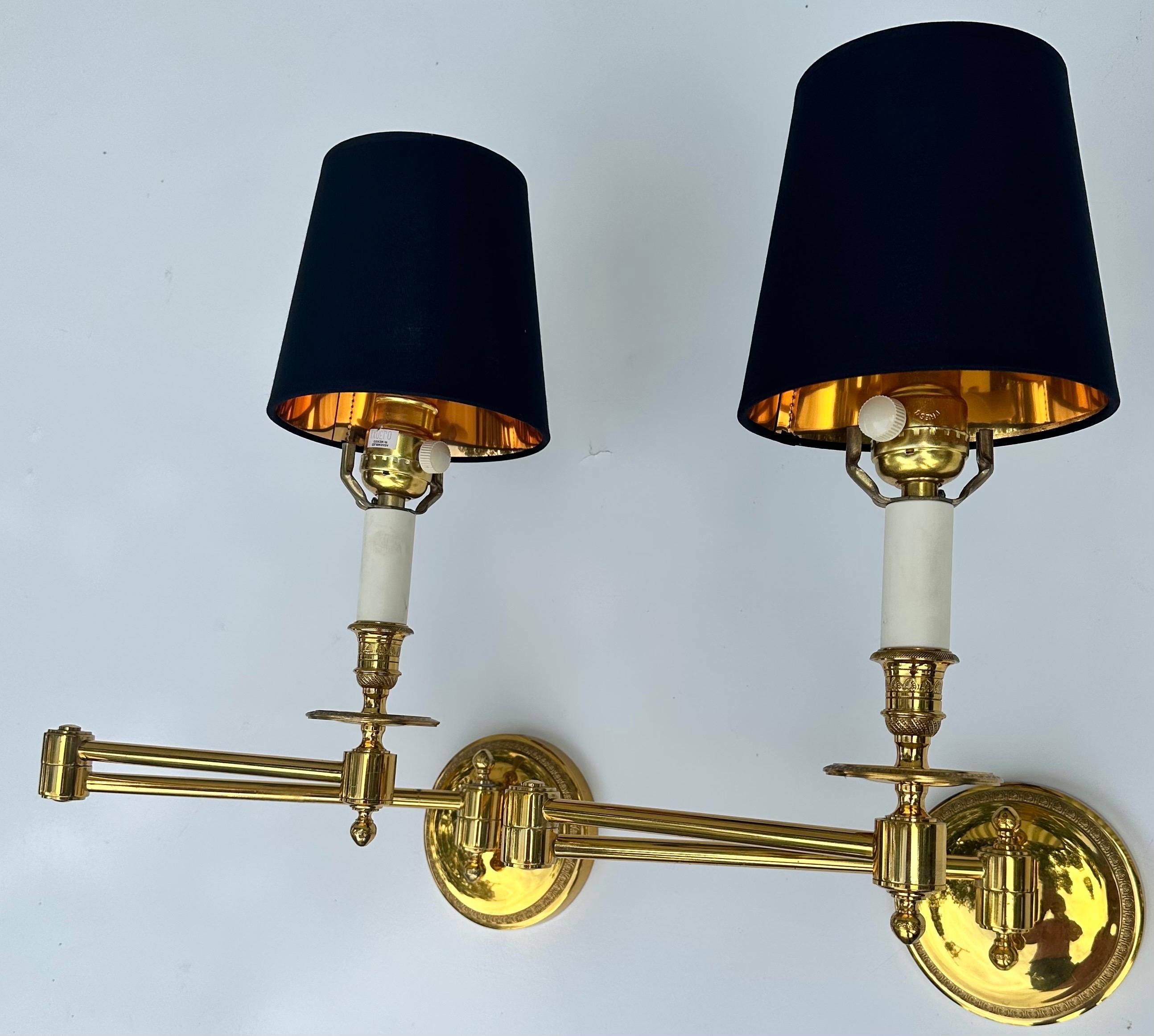 Pair of Bronze retractable Sconces made by the famous Maison Tisserand ( signed in the back )
US rewired and in working condition, dimmer on each socket. 100 watts bulb max or LED .
5 inches diameter backplate.
